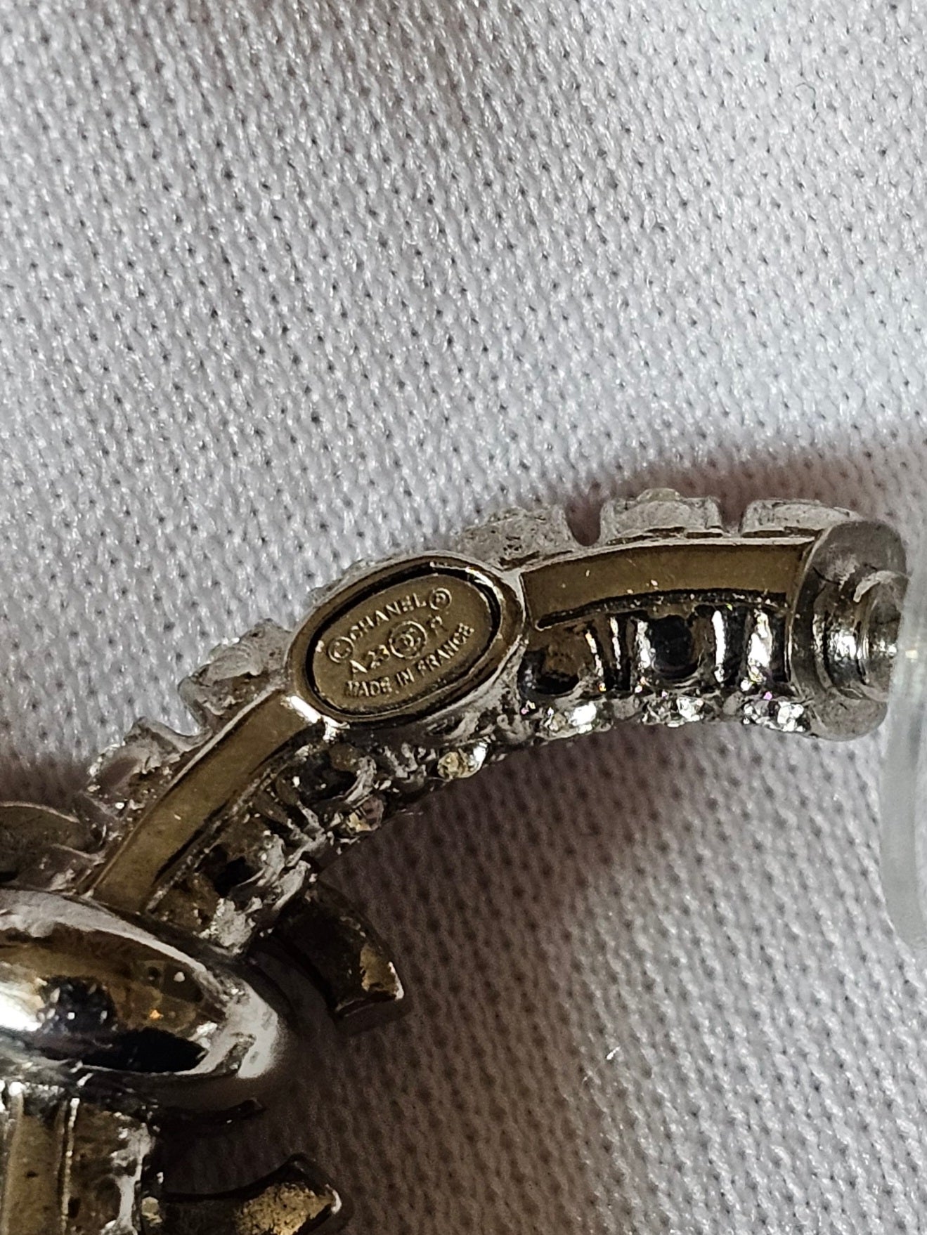 Chanel small hoops, silver with stones.
