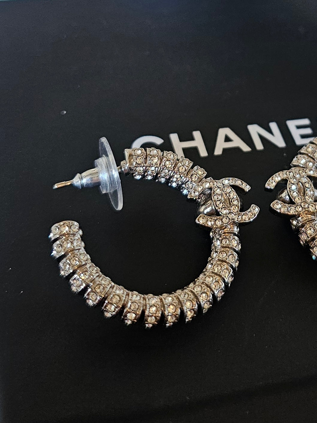 Chanel small hoops, silver with stones.