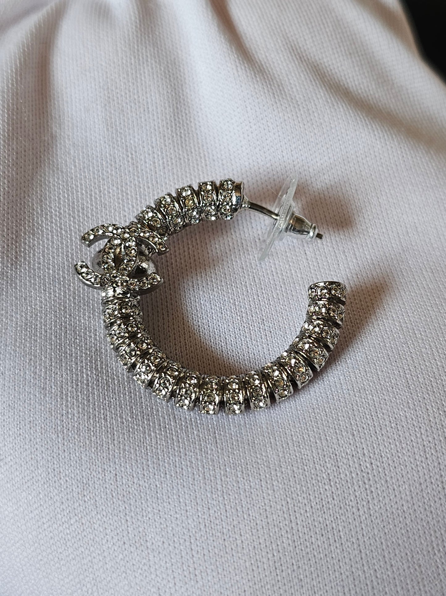 Chanel small hoops, silver with stones.