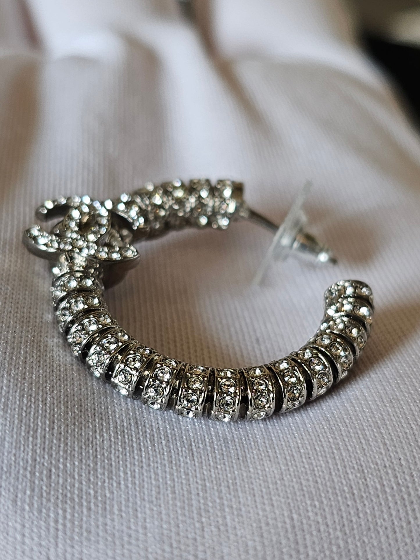 Chanel small hoops, silver with stones.