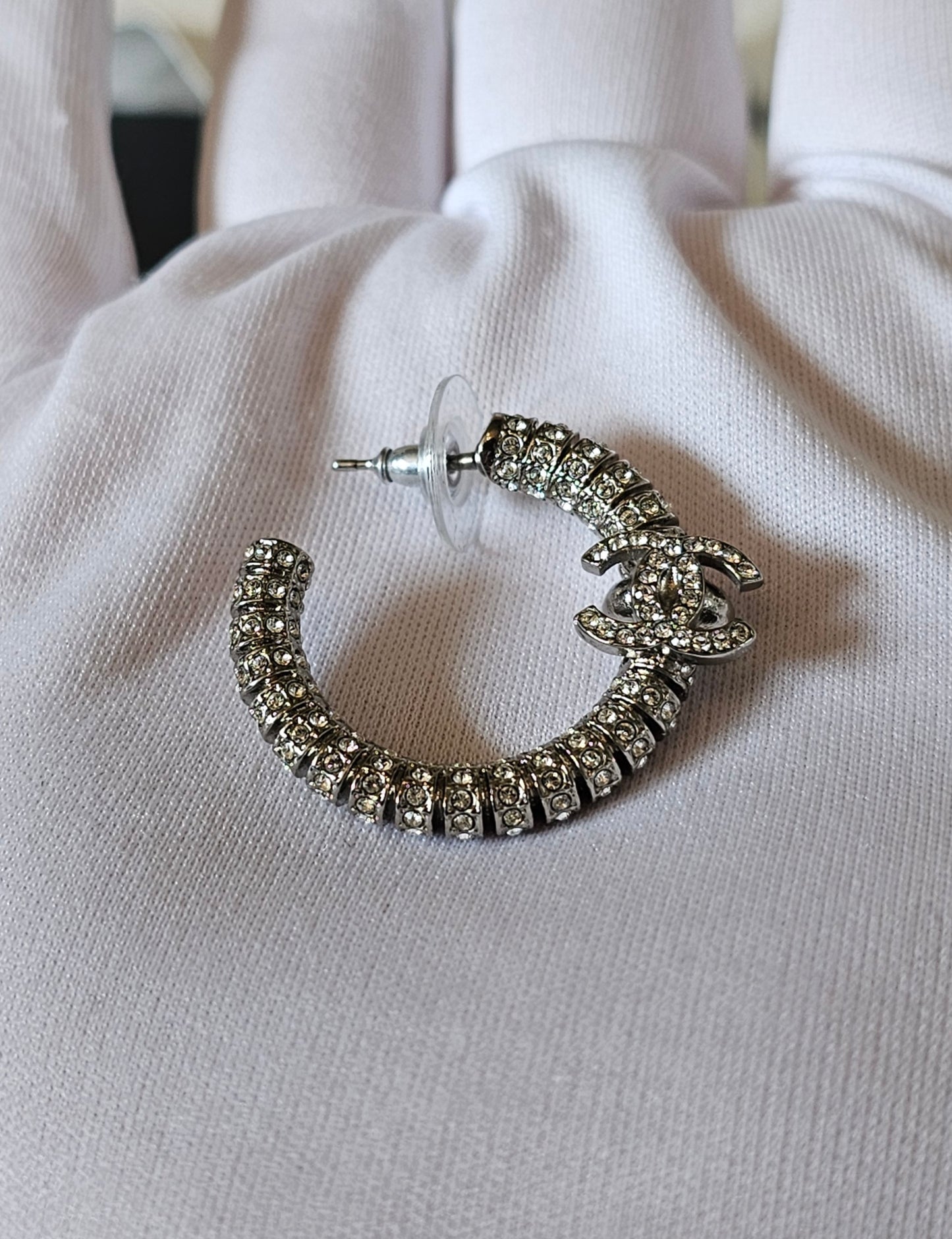 Chanel small hoops, silver with stones.