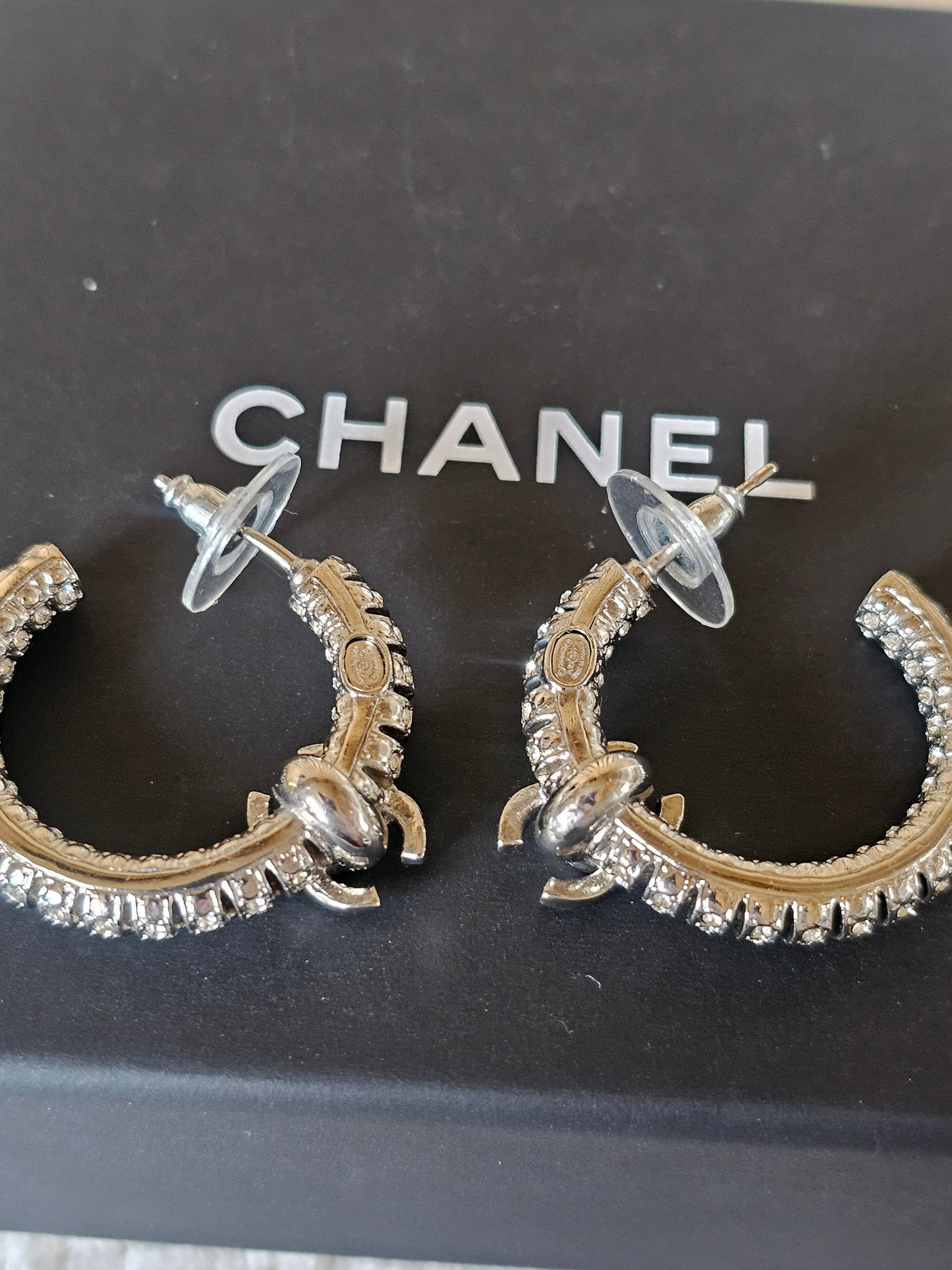 Chanel small hoops, silver with stones.