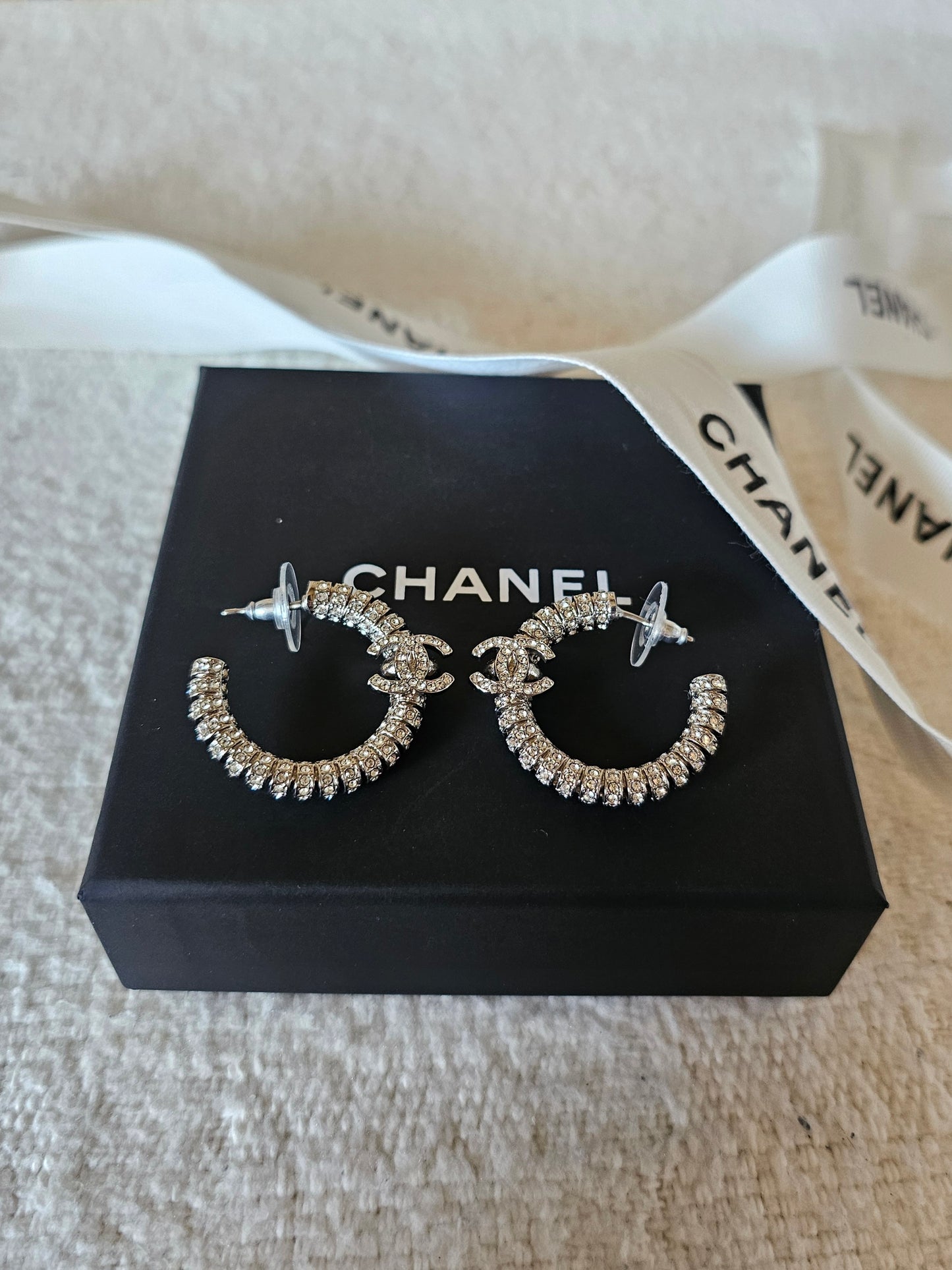 Chanel small hoops, silver with stones.