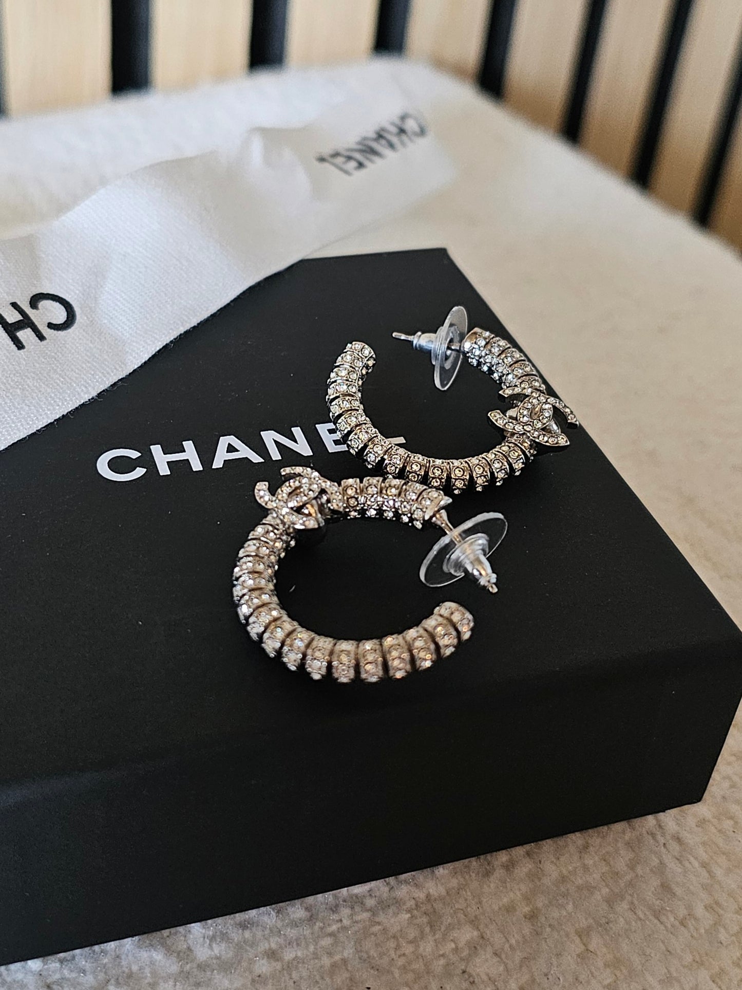 Chanel small hoops, silver with stones.