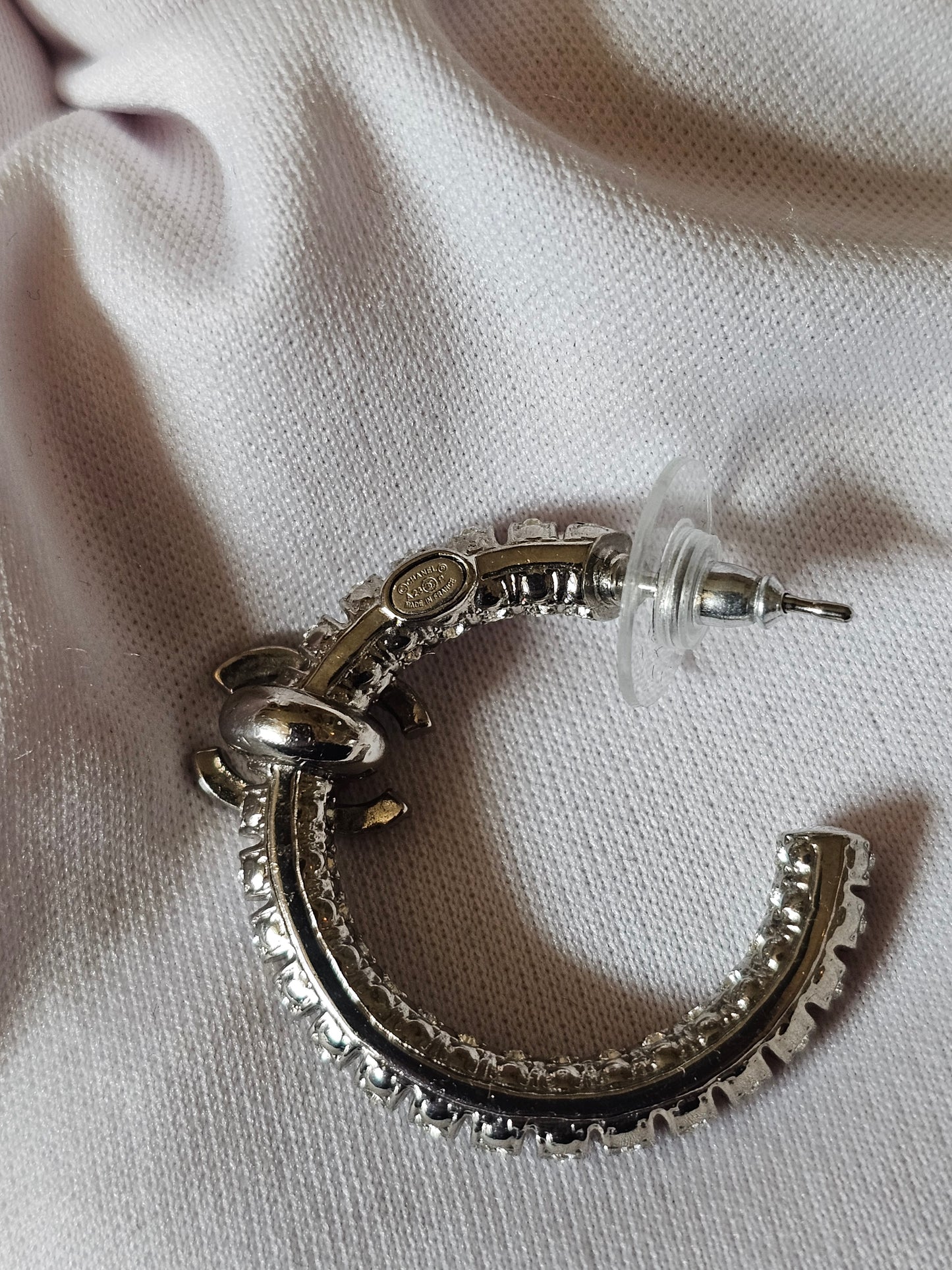 Chanel small hoops, silver with stones.
