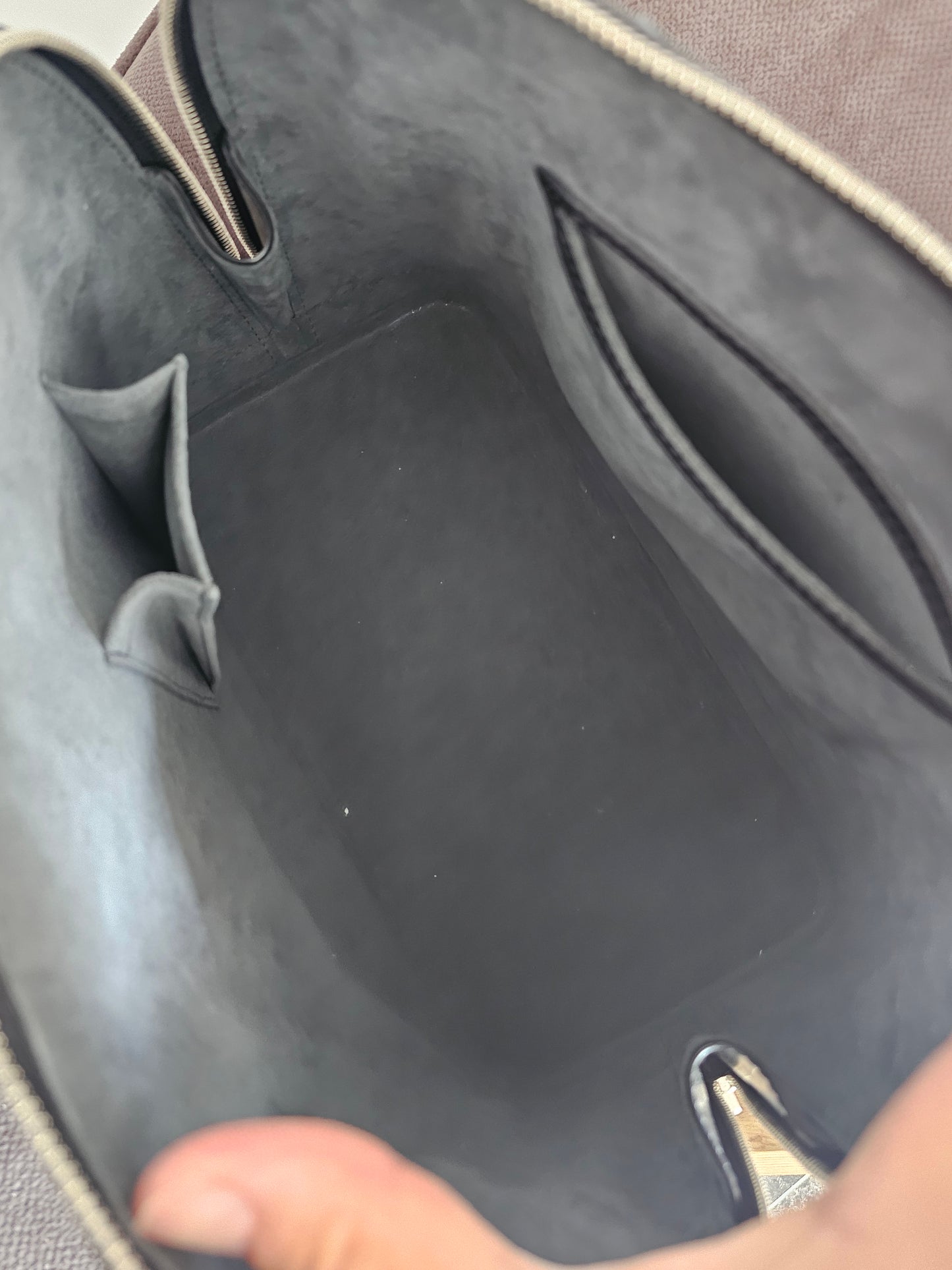 Louis Vuitton Alma PM with adjustable shoulder strap.