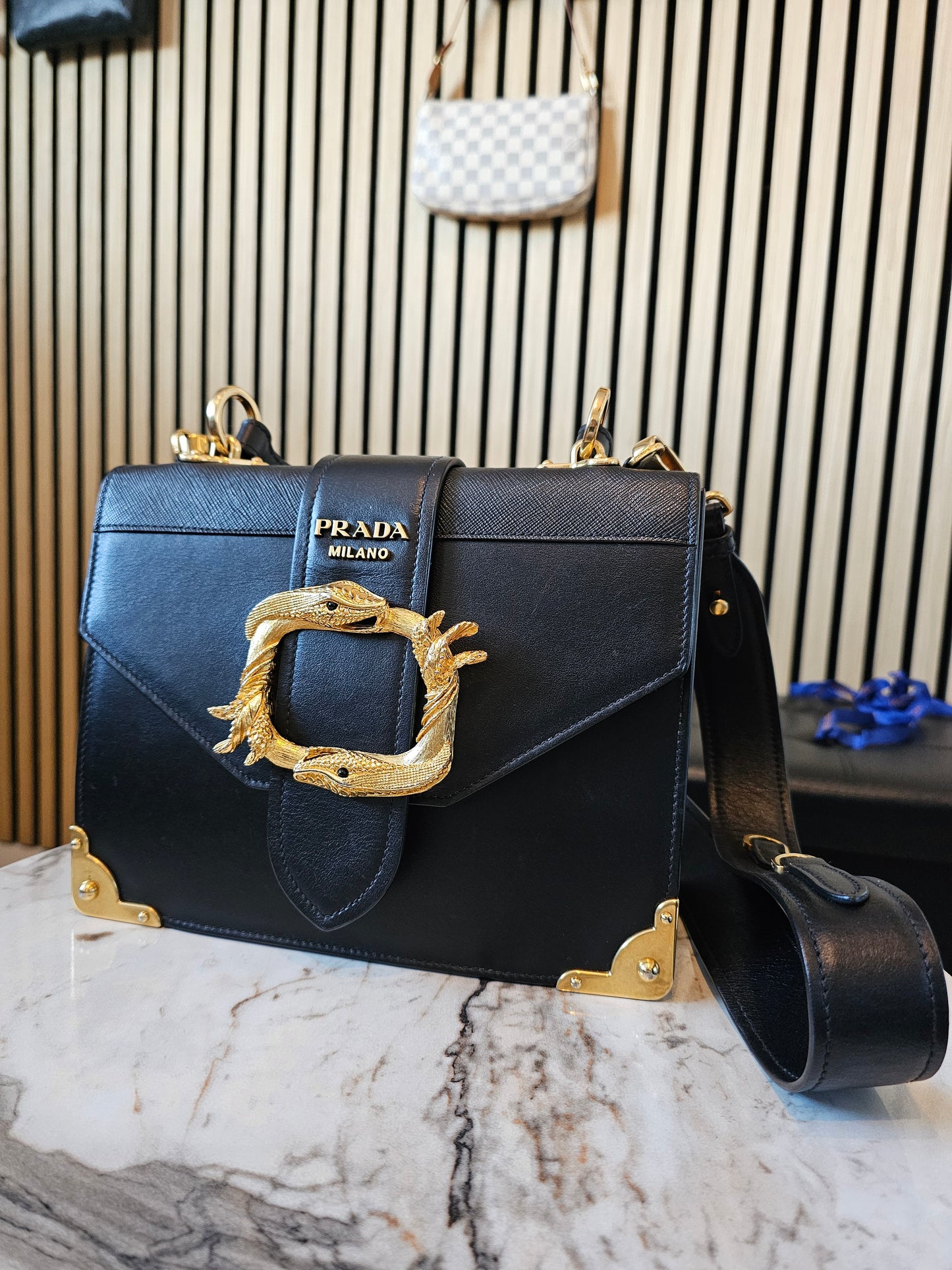 Prada Cahier bag animalier, black saffiano leather.