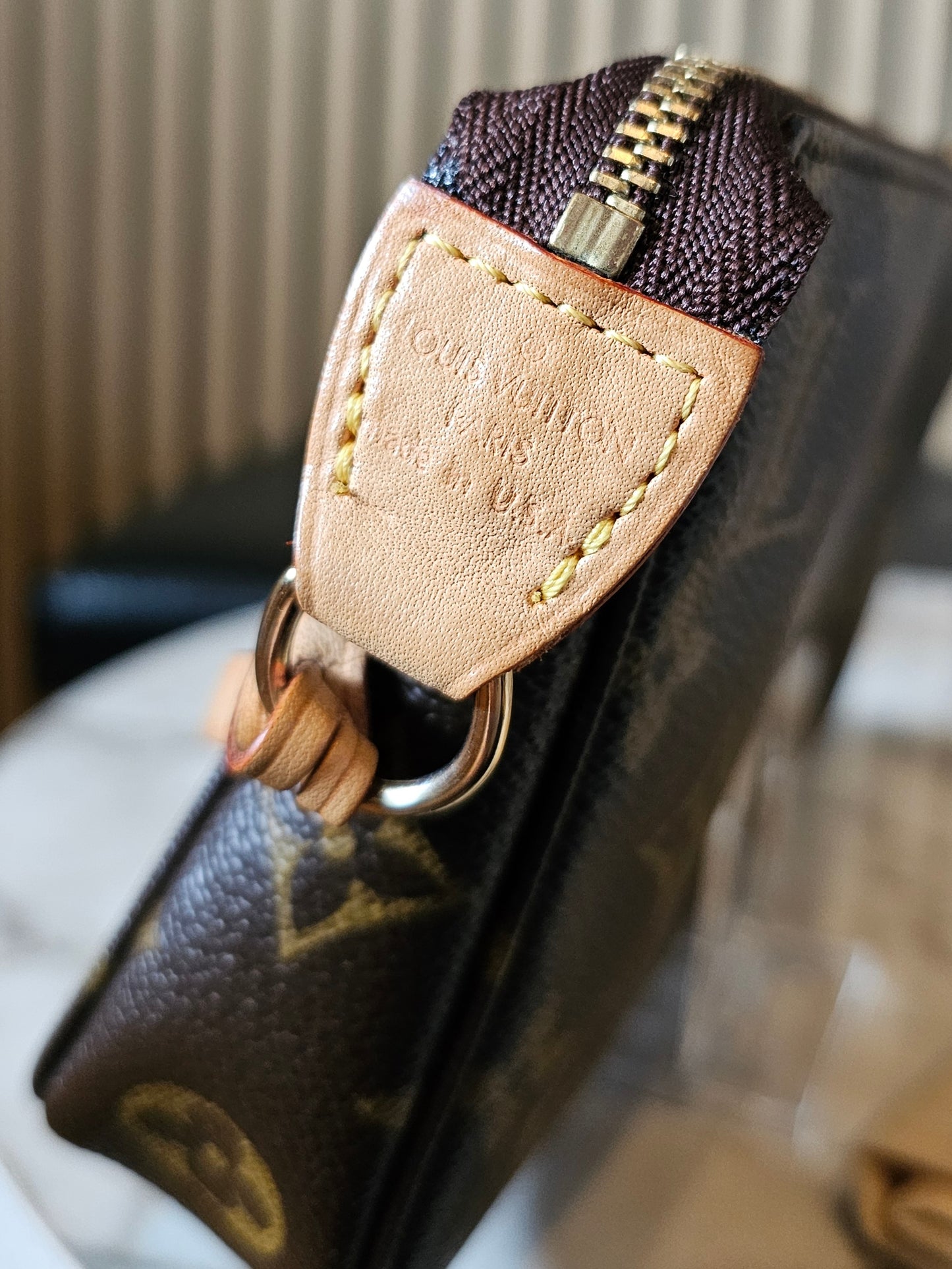 Louis Vuitton pochette accesories in monogram kanvas.