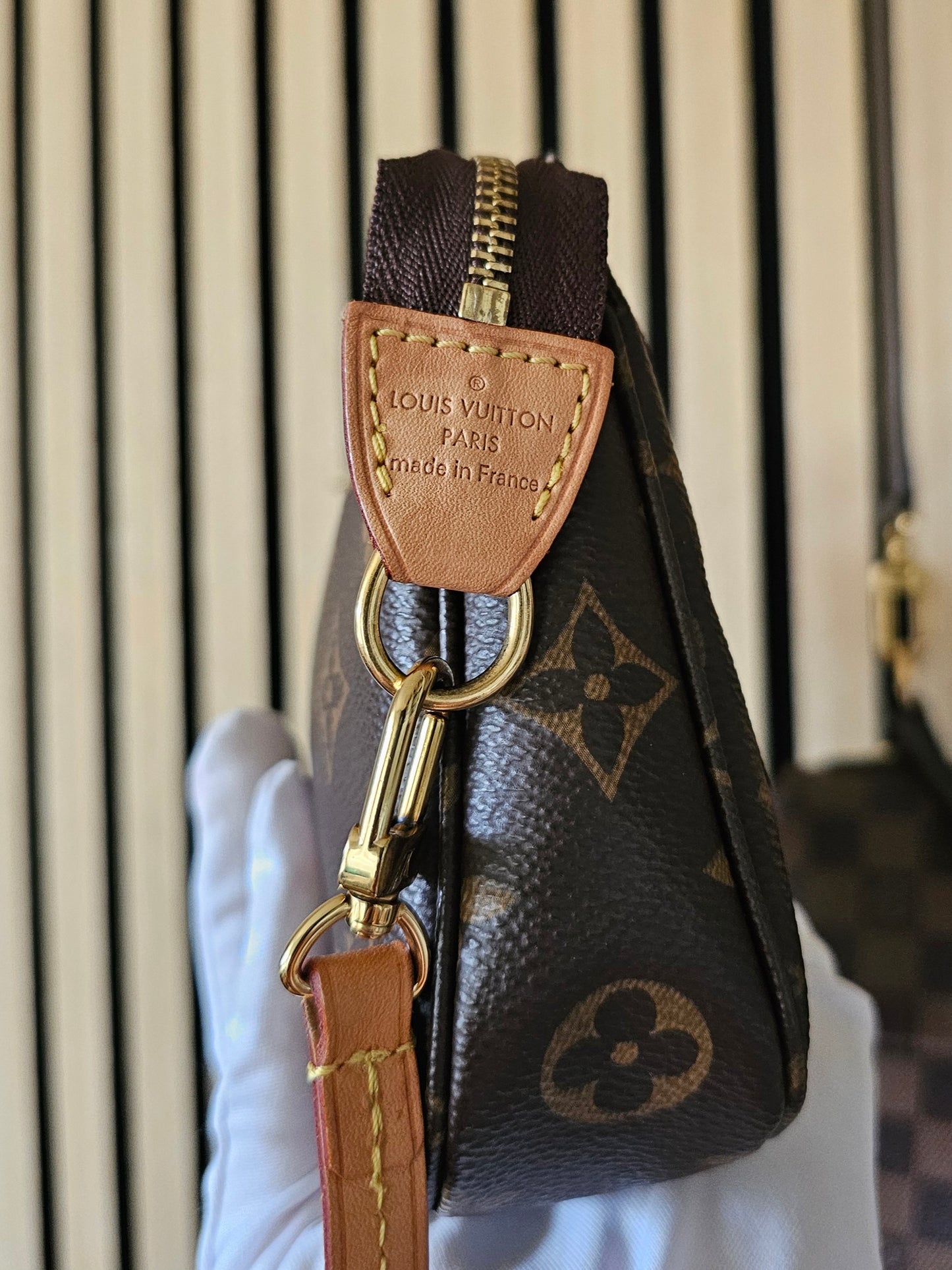 Pochette accesories NM in monogram kanvas.