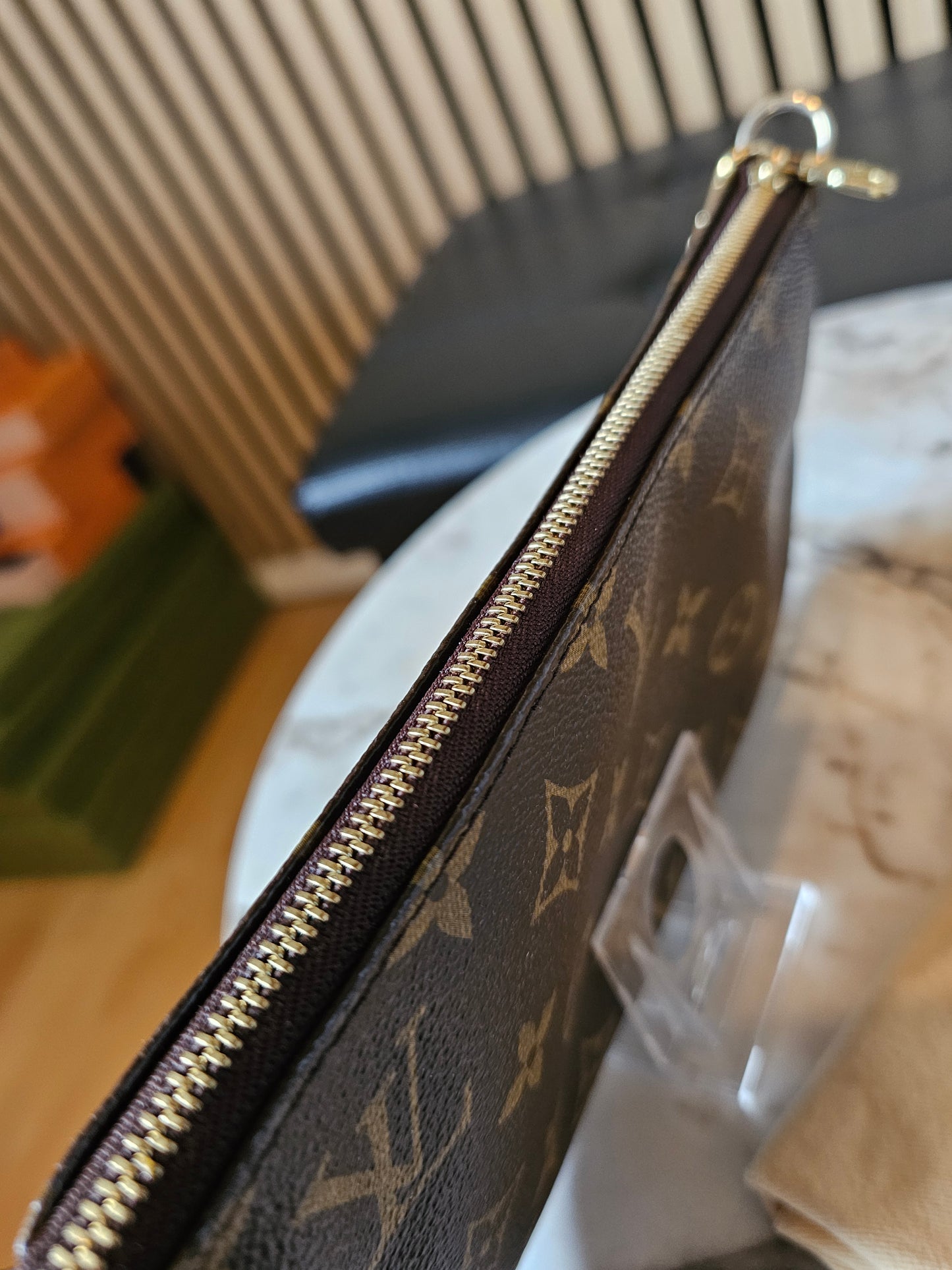 Louis Vuitton pochette accesories in monogram kanvas.