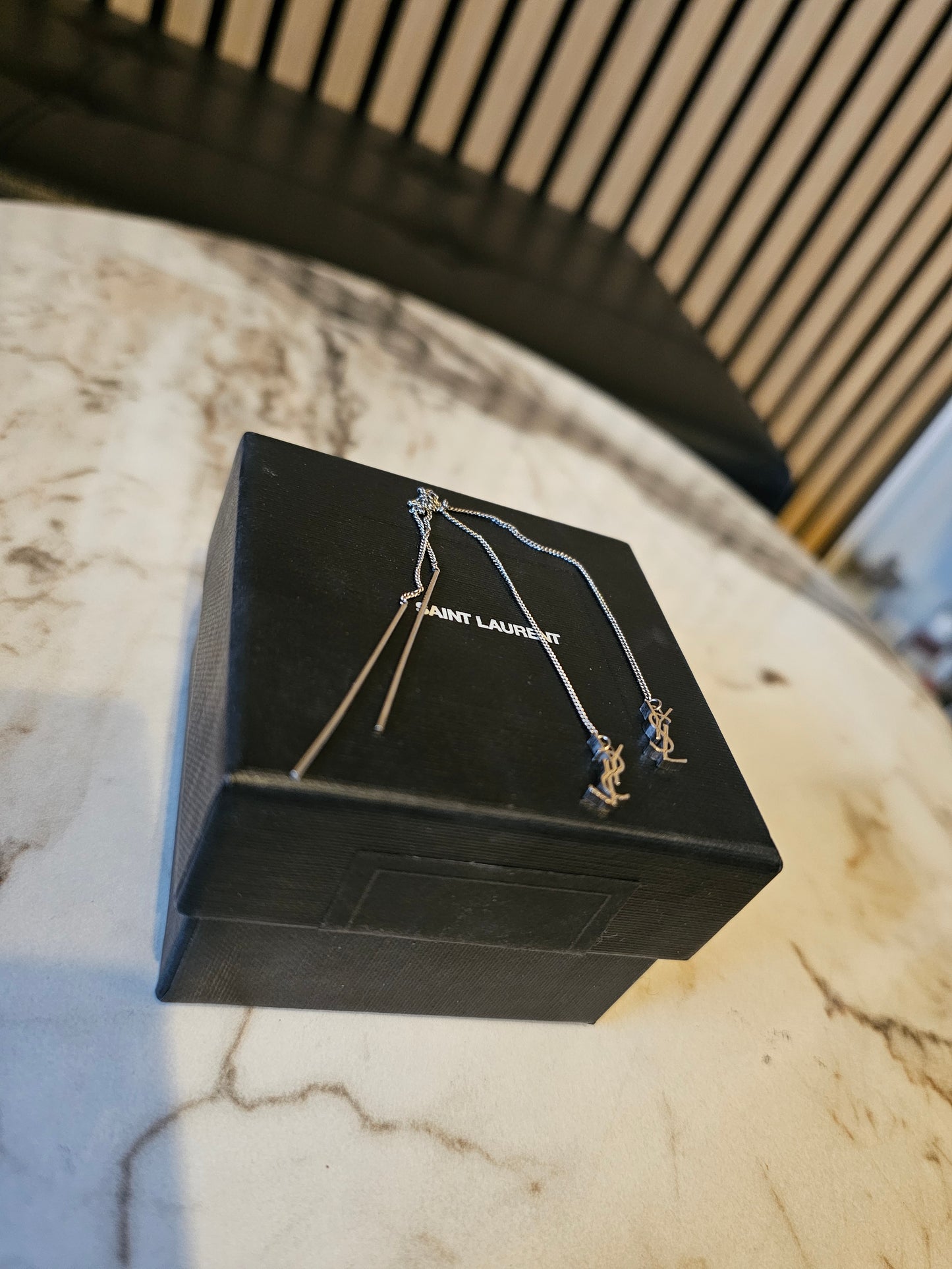 YSL Cassandre long earrings in silver.