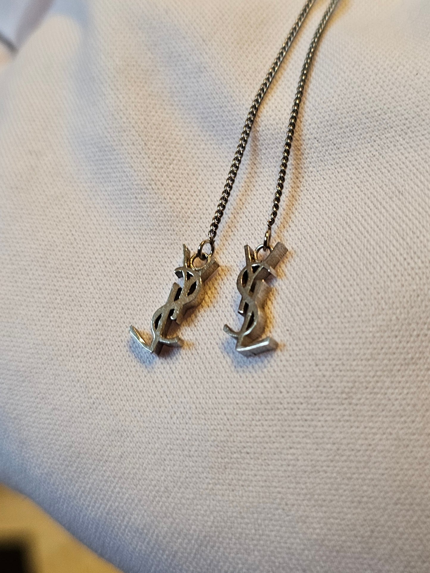 YSL Cassandre long earrings in silver.