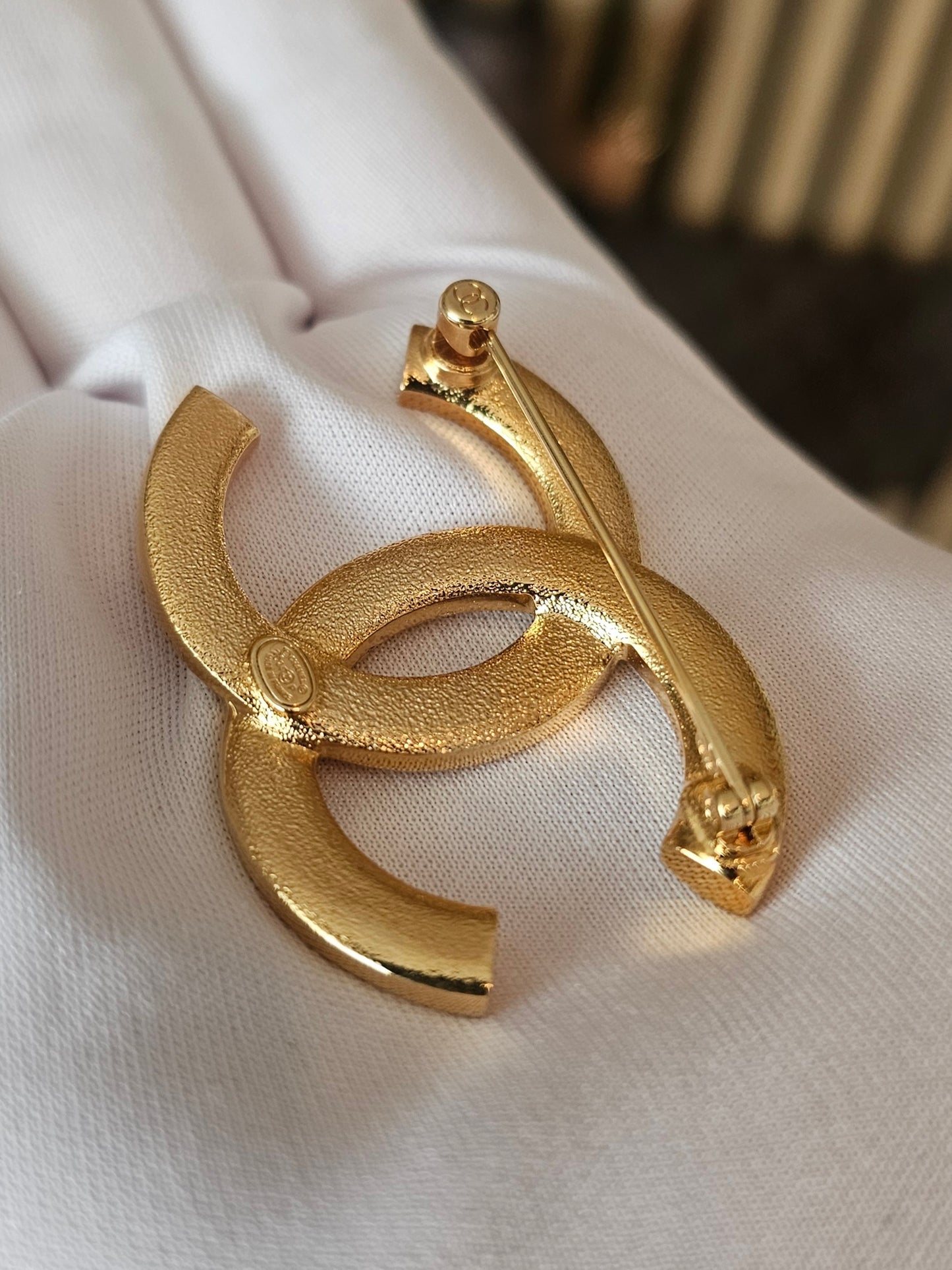 Chanel golden broche with stones and Chanel.