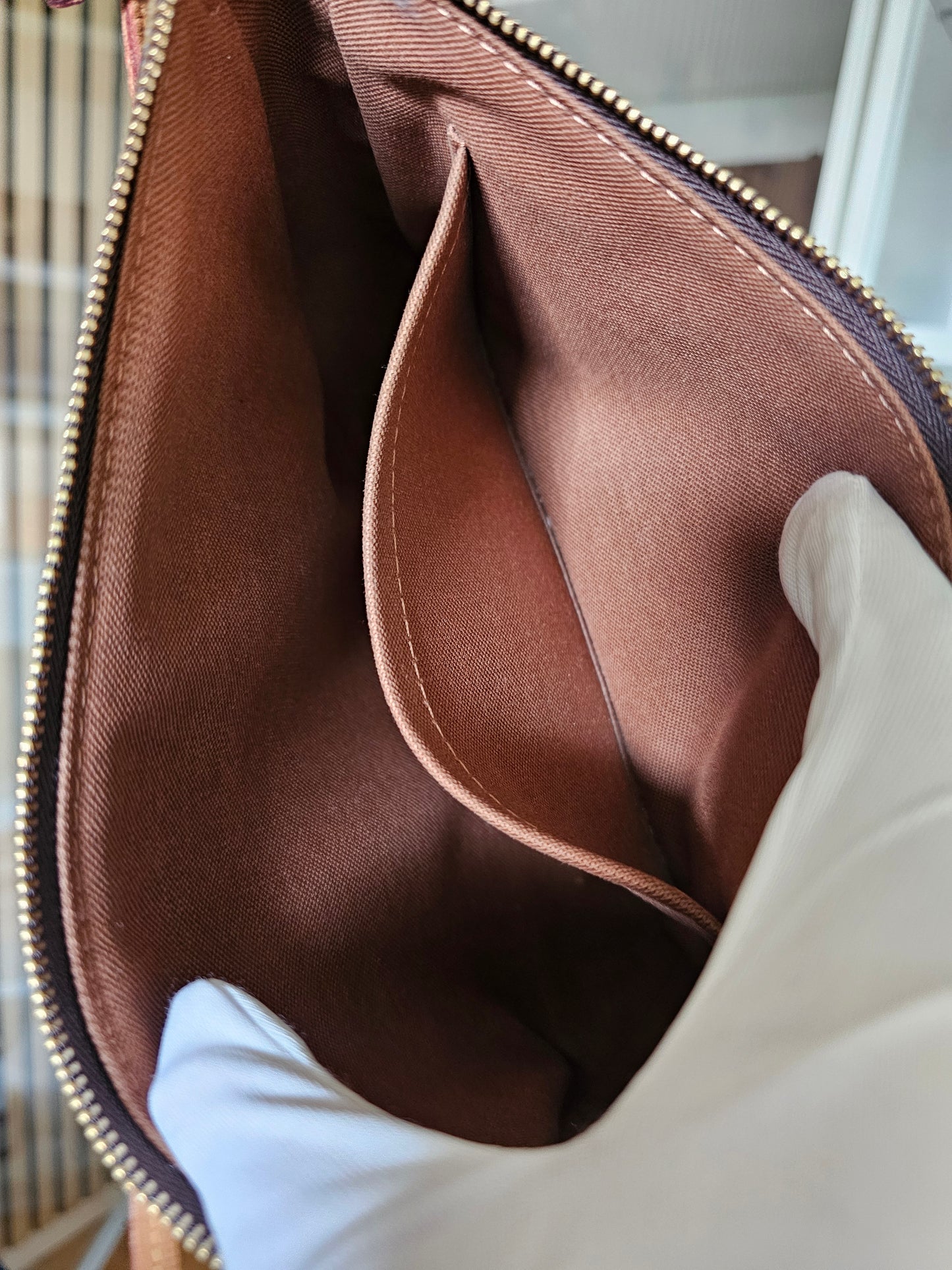 Pochette accesories NM in monogram kanvas.