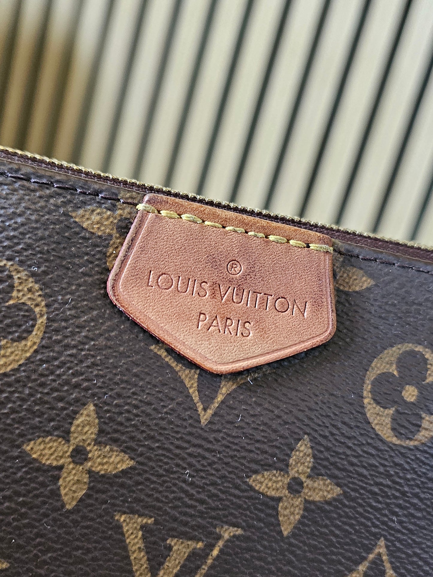 Louis Vuitton pochette accesories in monogram kanvas.