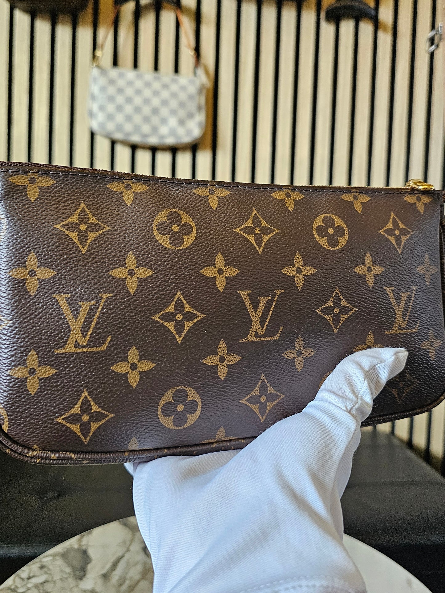 Louis Vuitton pochette accesories in monogram kanvas.