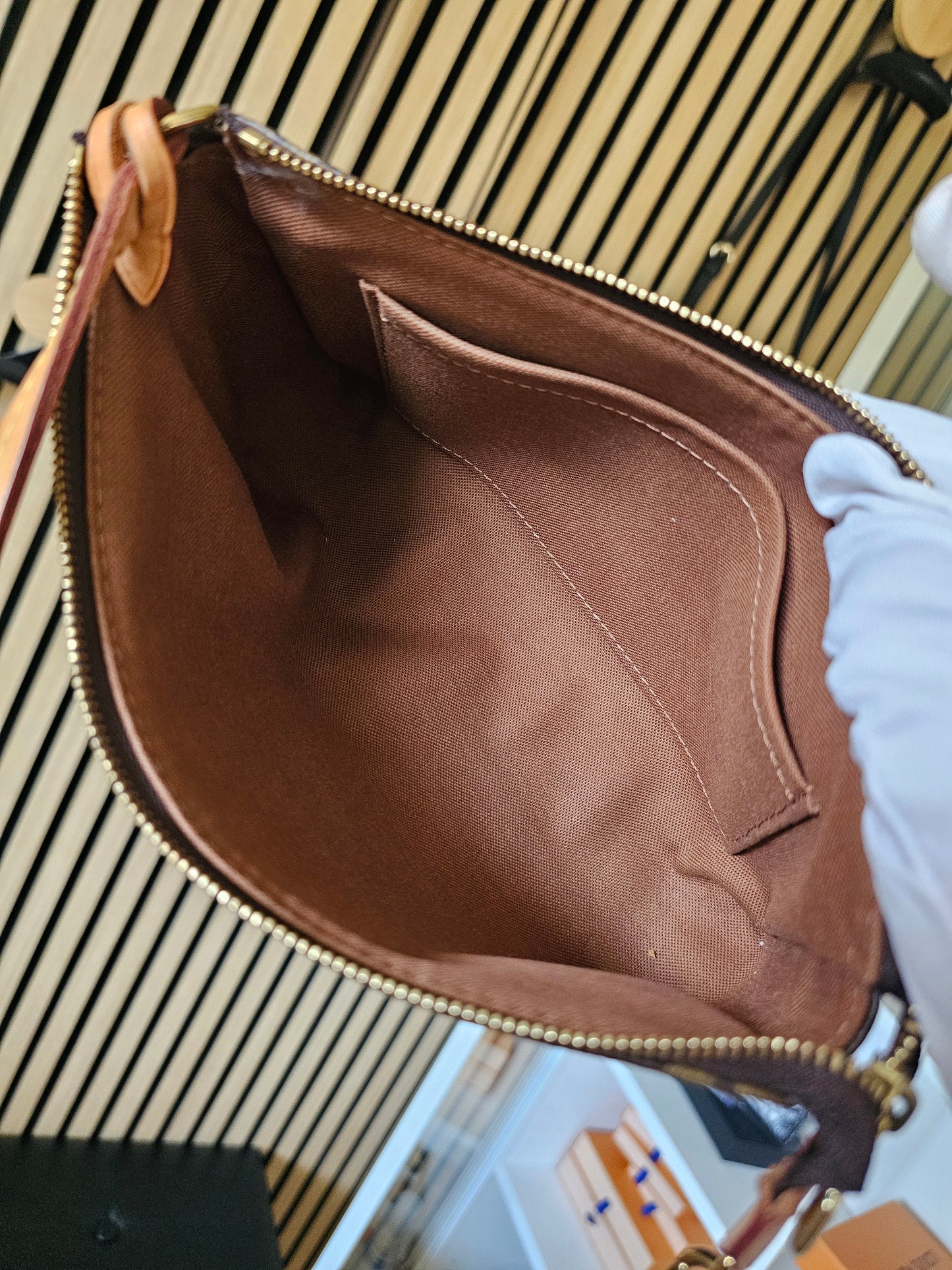 Pochette accesories NM in monogram kanvas.