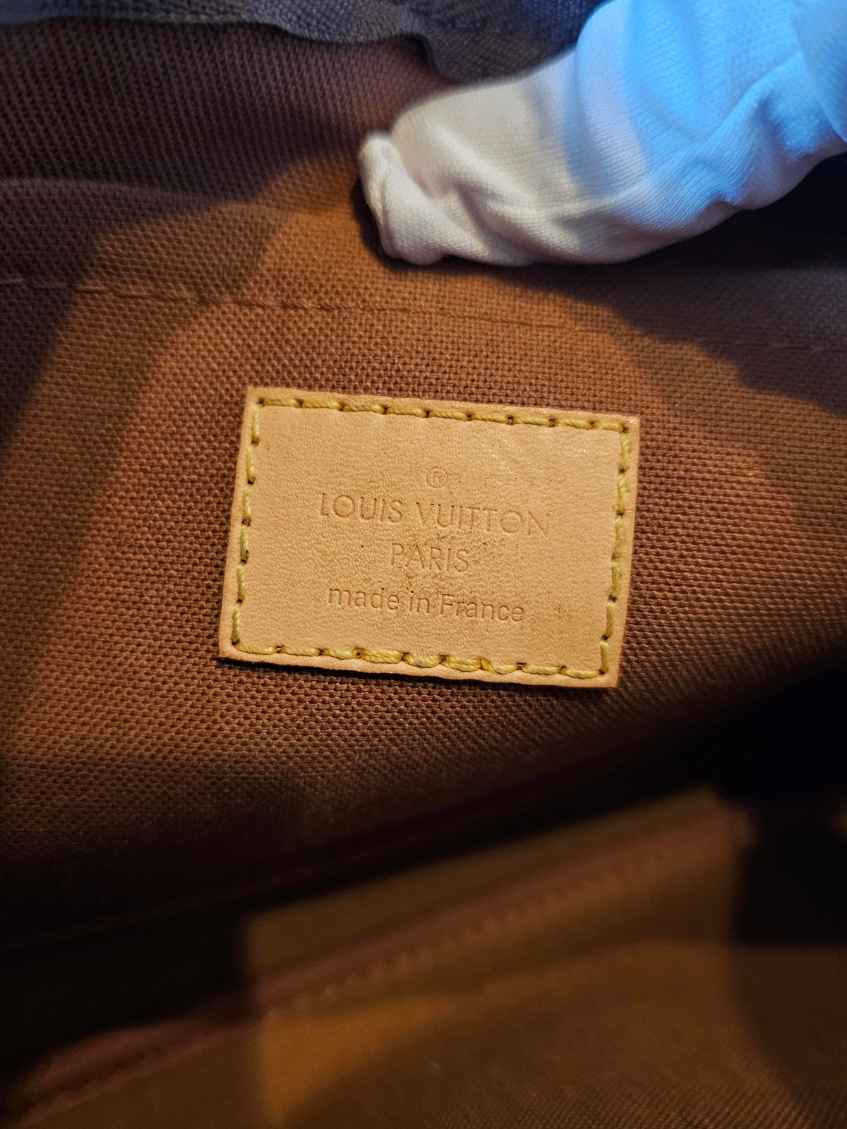 Louis Vuitton large pochette in monogram kanvas.
