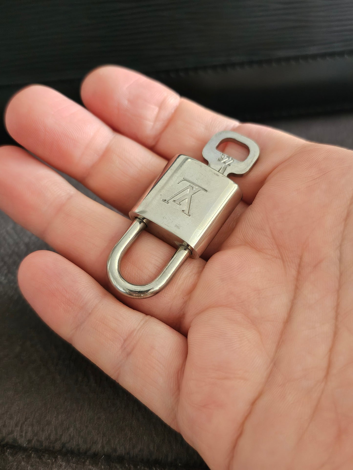 Louis Vuitton Alma PM with adjustable shoulder strap.