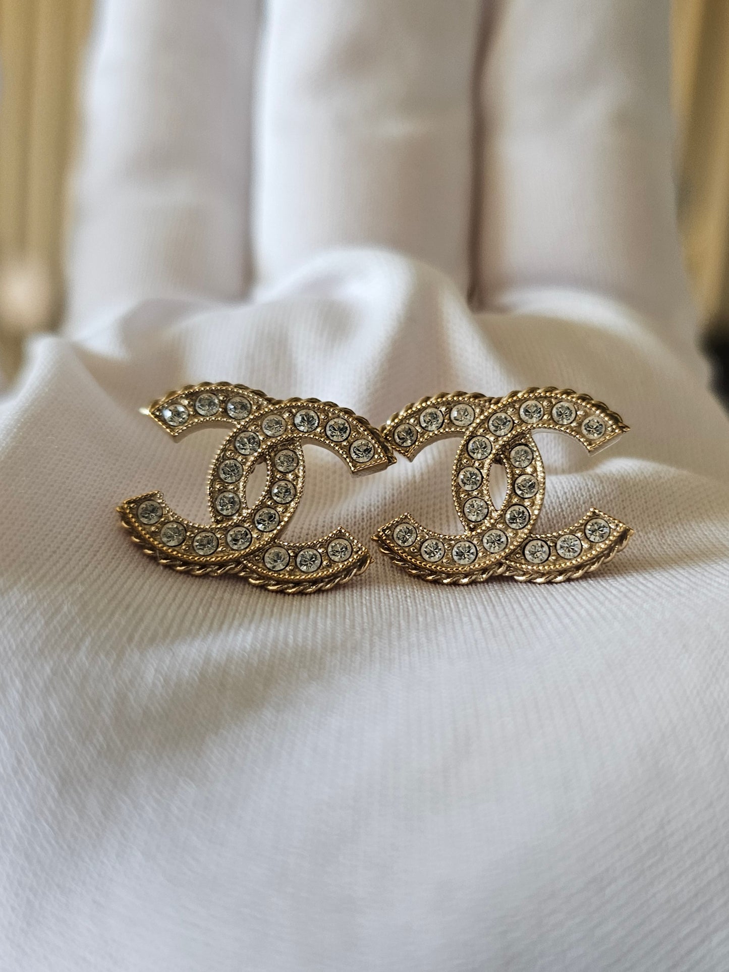 Chanel earrings, golden cc with stones.