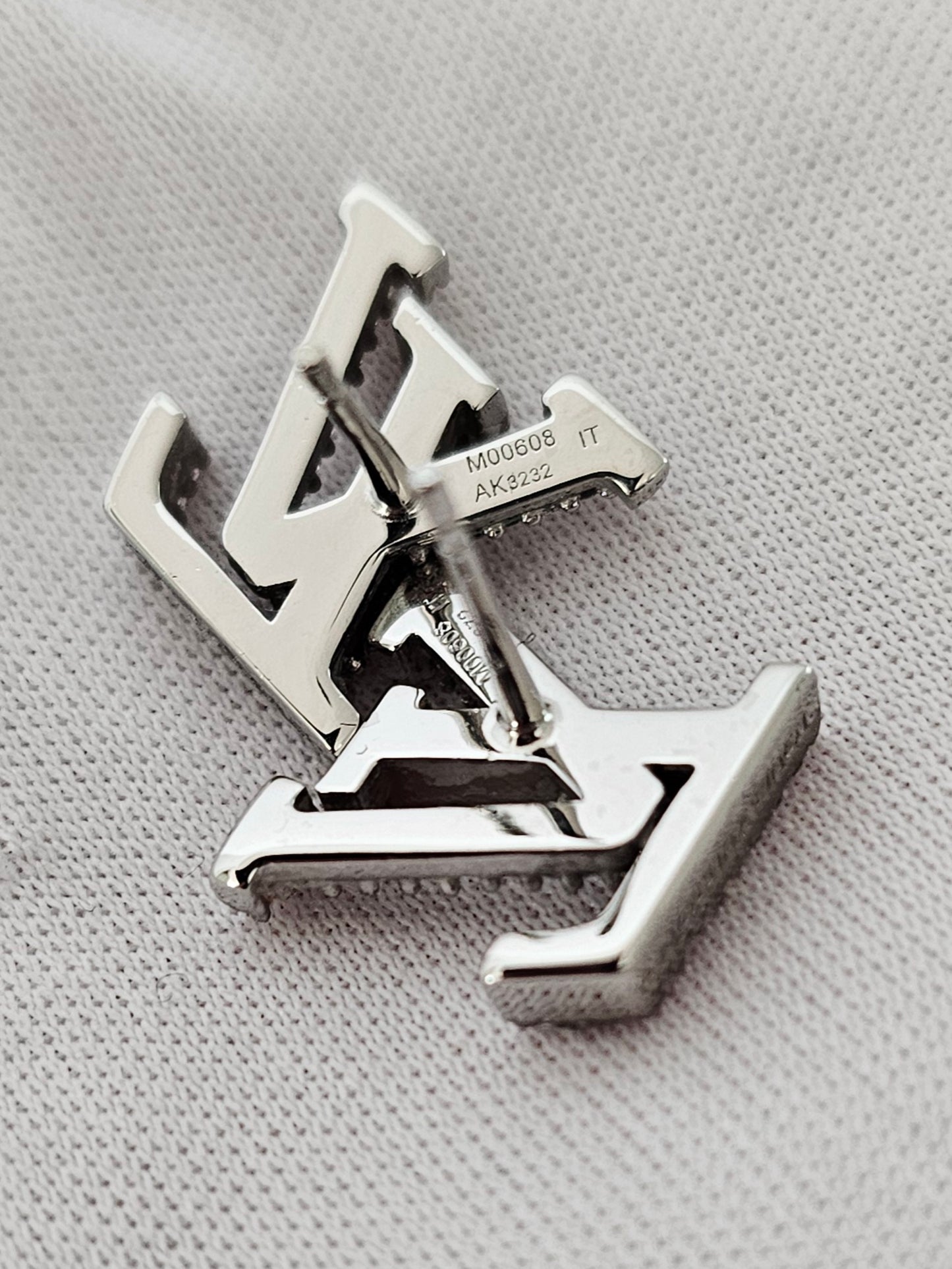 Louis Vuitton iconic LV earrings, silver/palladium with stones.