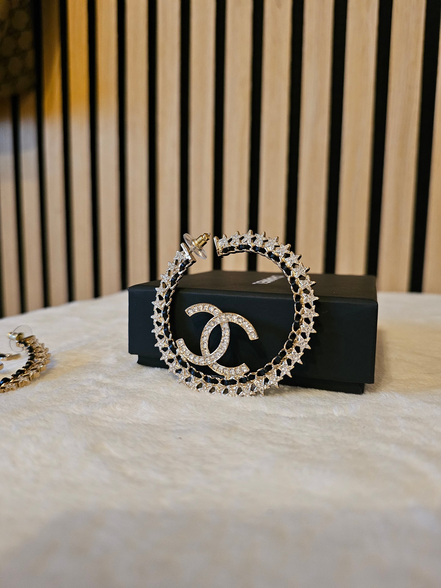 Chanel Golden hoops with crystals.