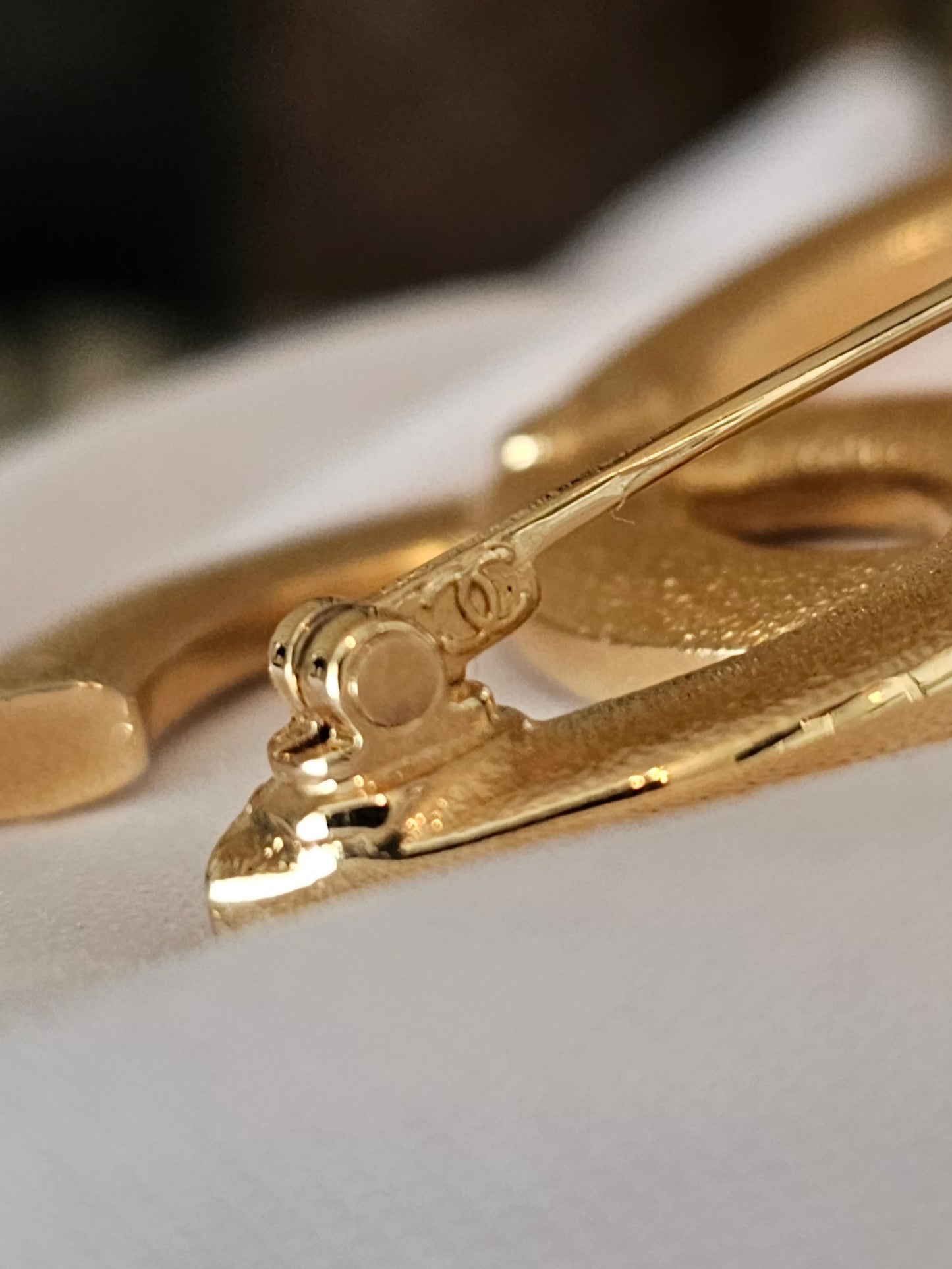 Chanel golden broche with stones and Chanel.