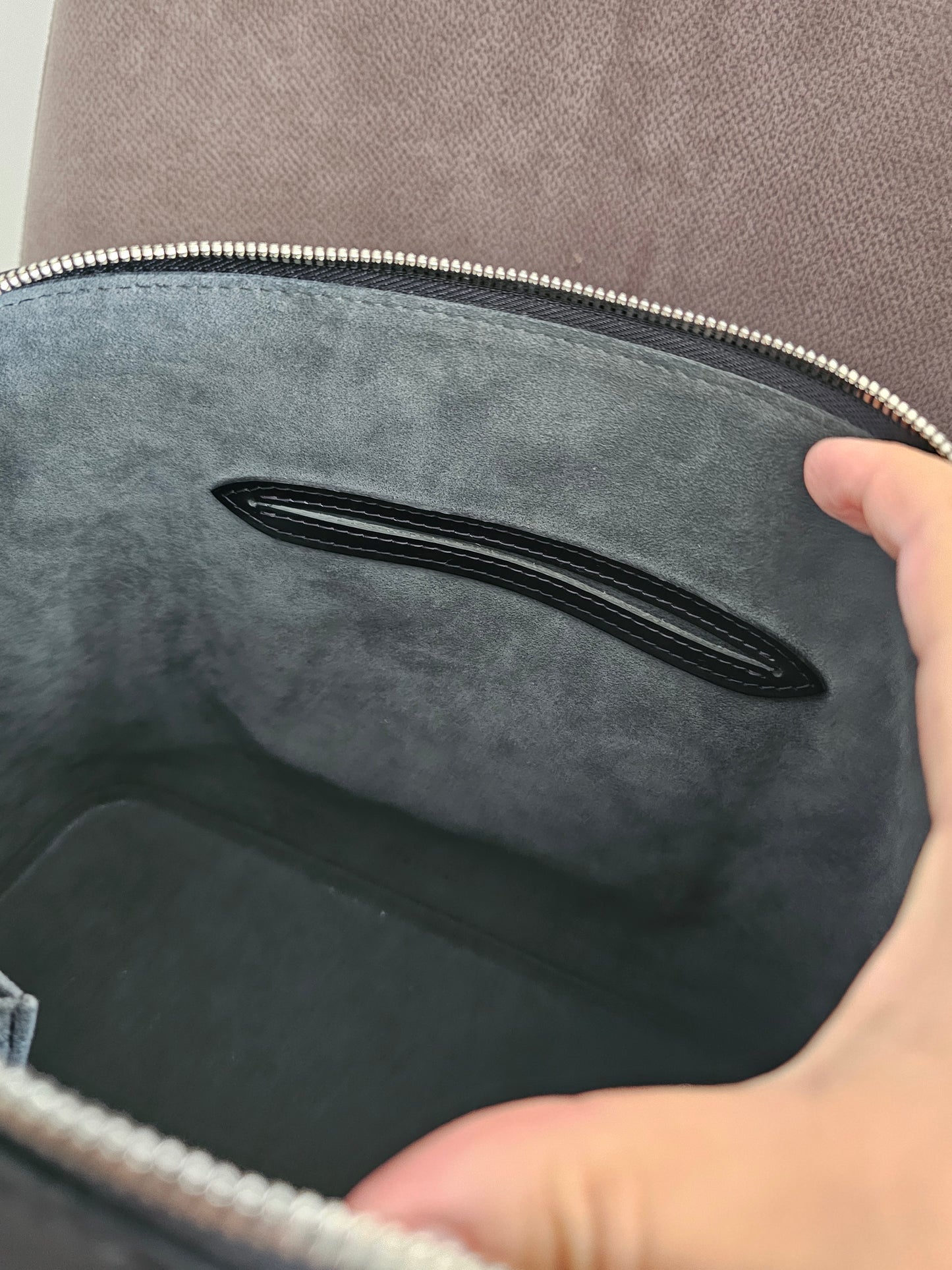 Louis Vuitton Alma PM with adjustable shoulder strap.