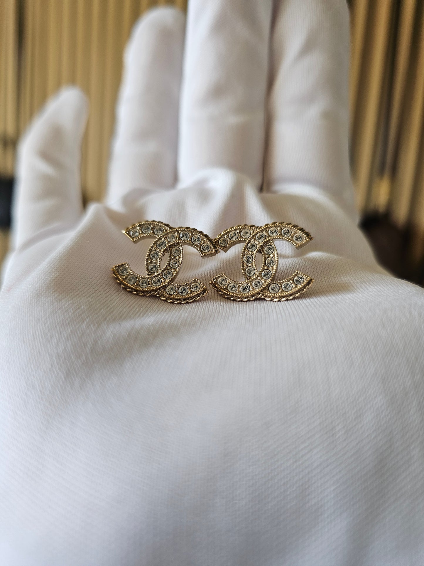 Chanel earrings, golden cc with stones.