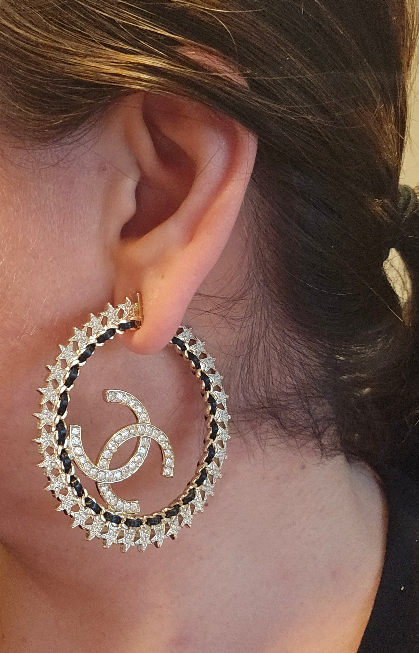 Chanel Golden hoops with crystals.