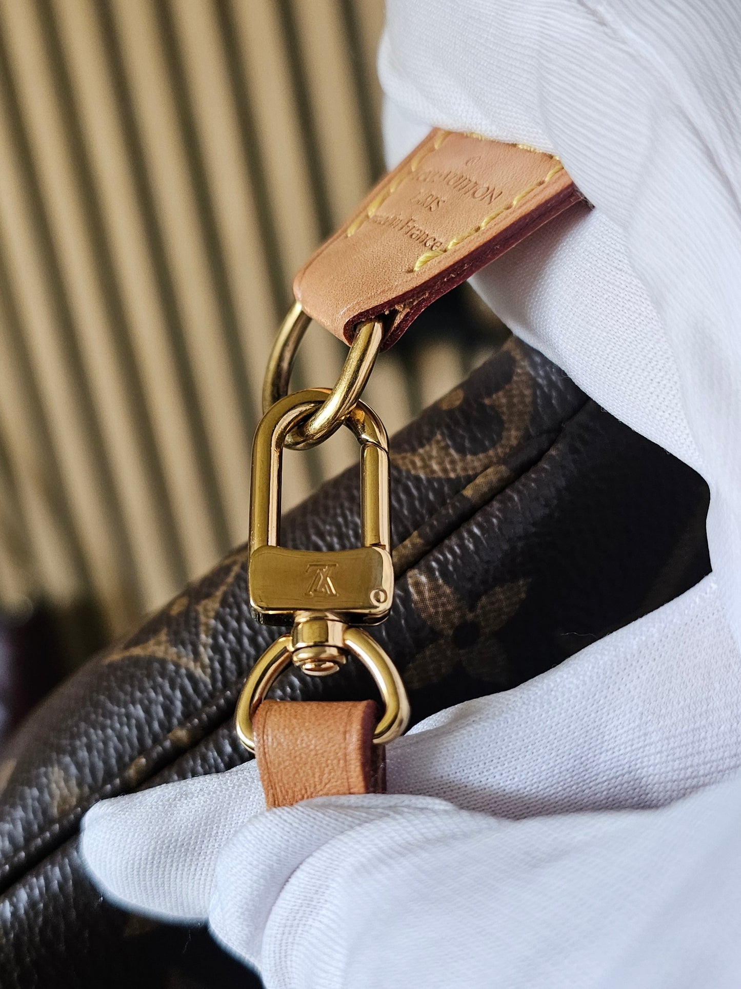 Pochette accesories NM in monogram kanvas.
