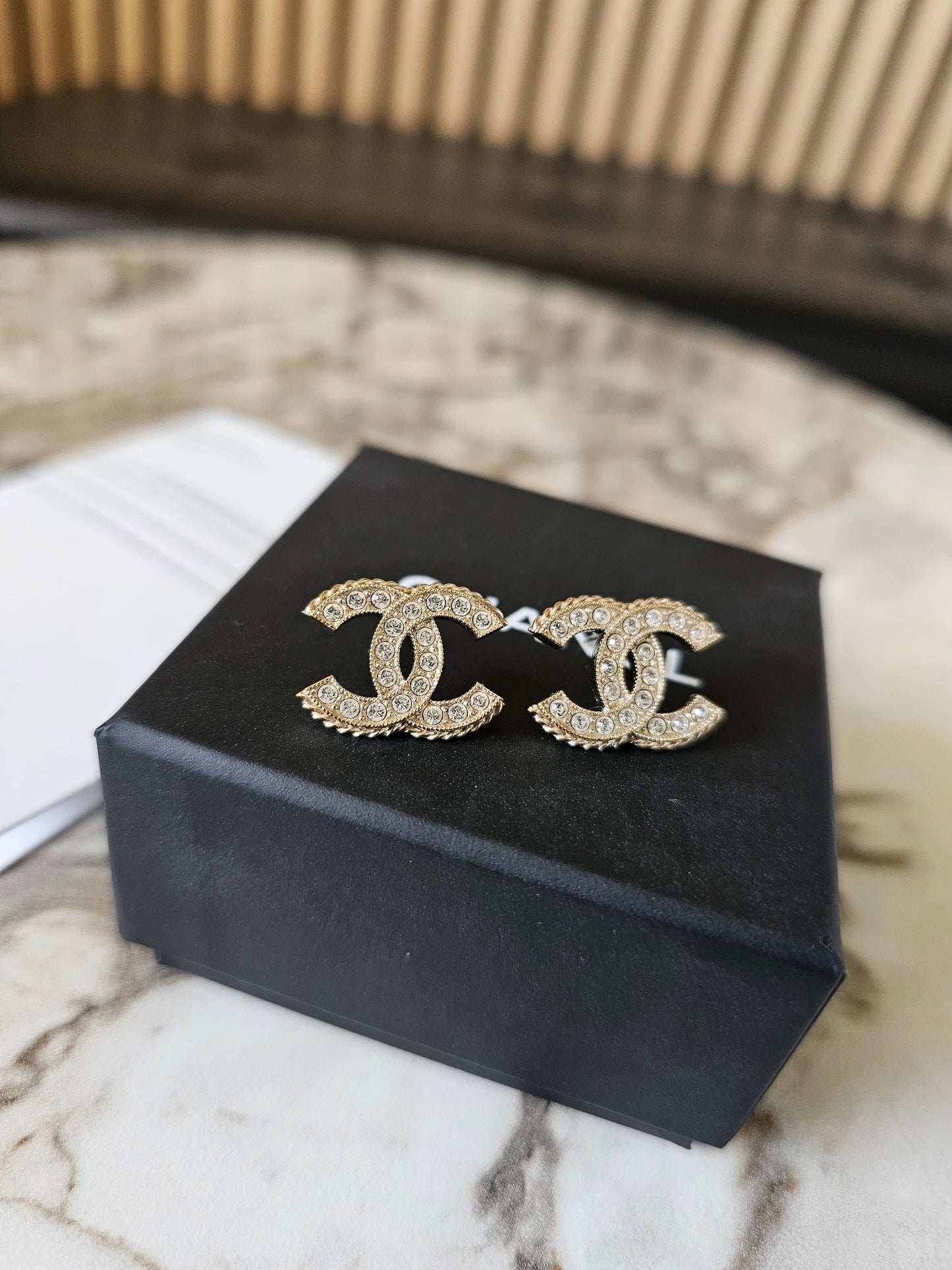 Chanel earrings, golden cc with stones.