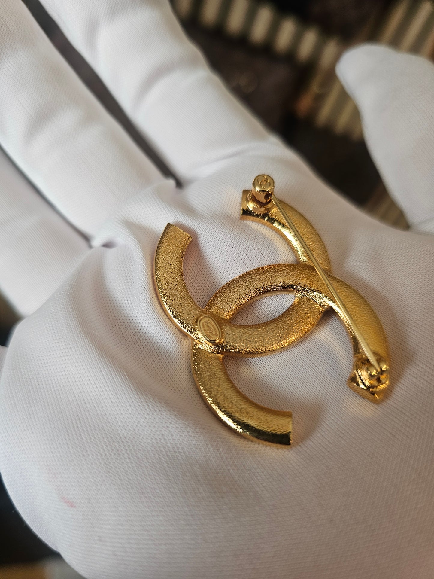 Chanel golden broche with stones and Chanel.