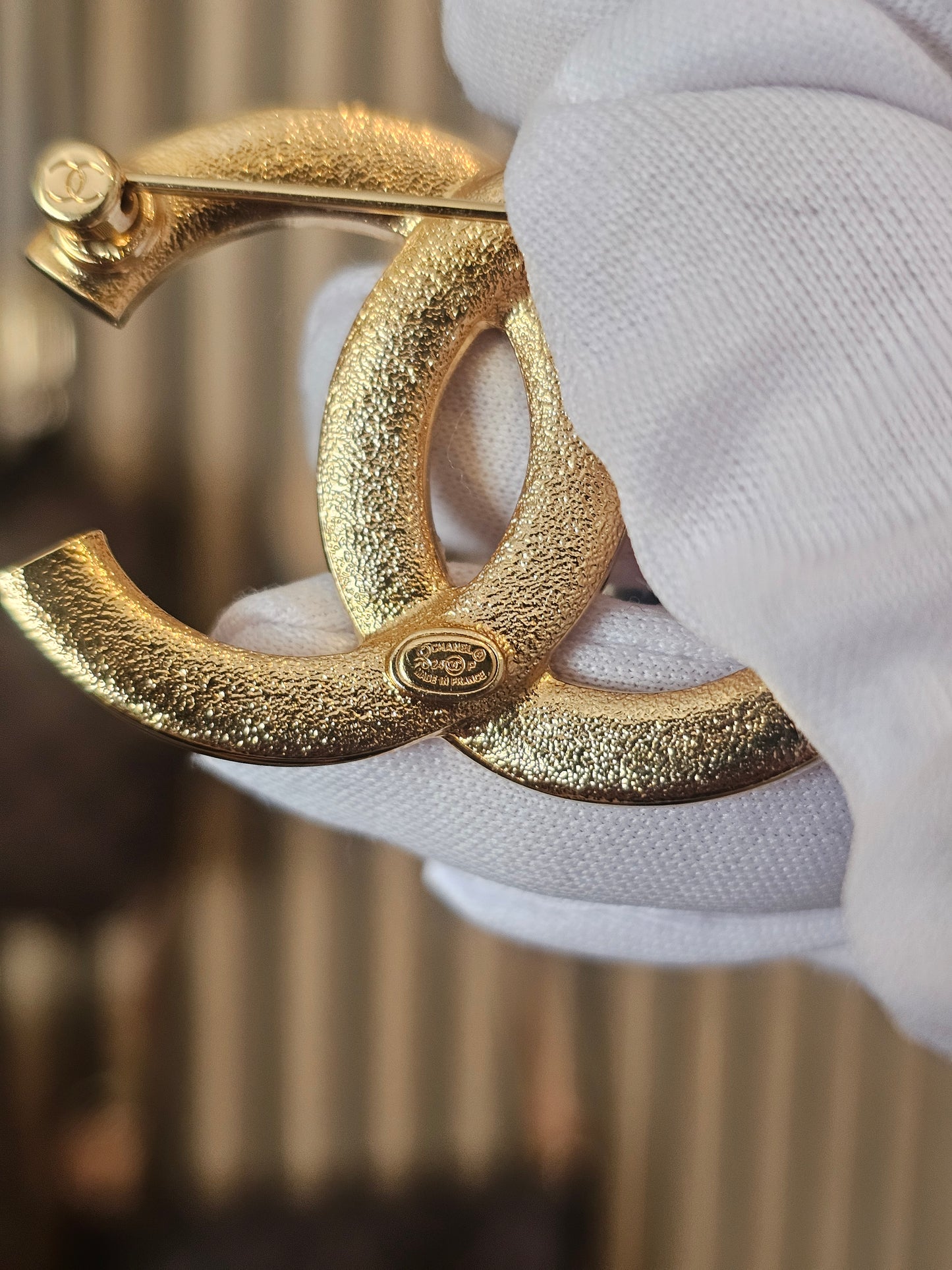 Chanel golden broche with stones and Chanel.