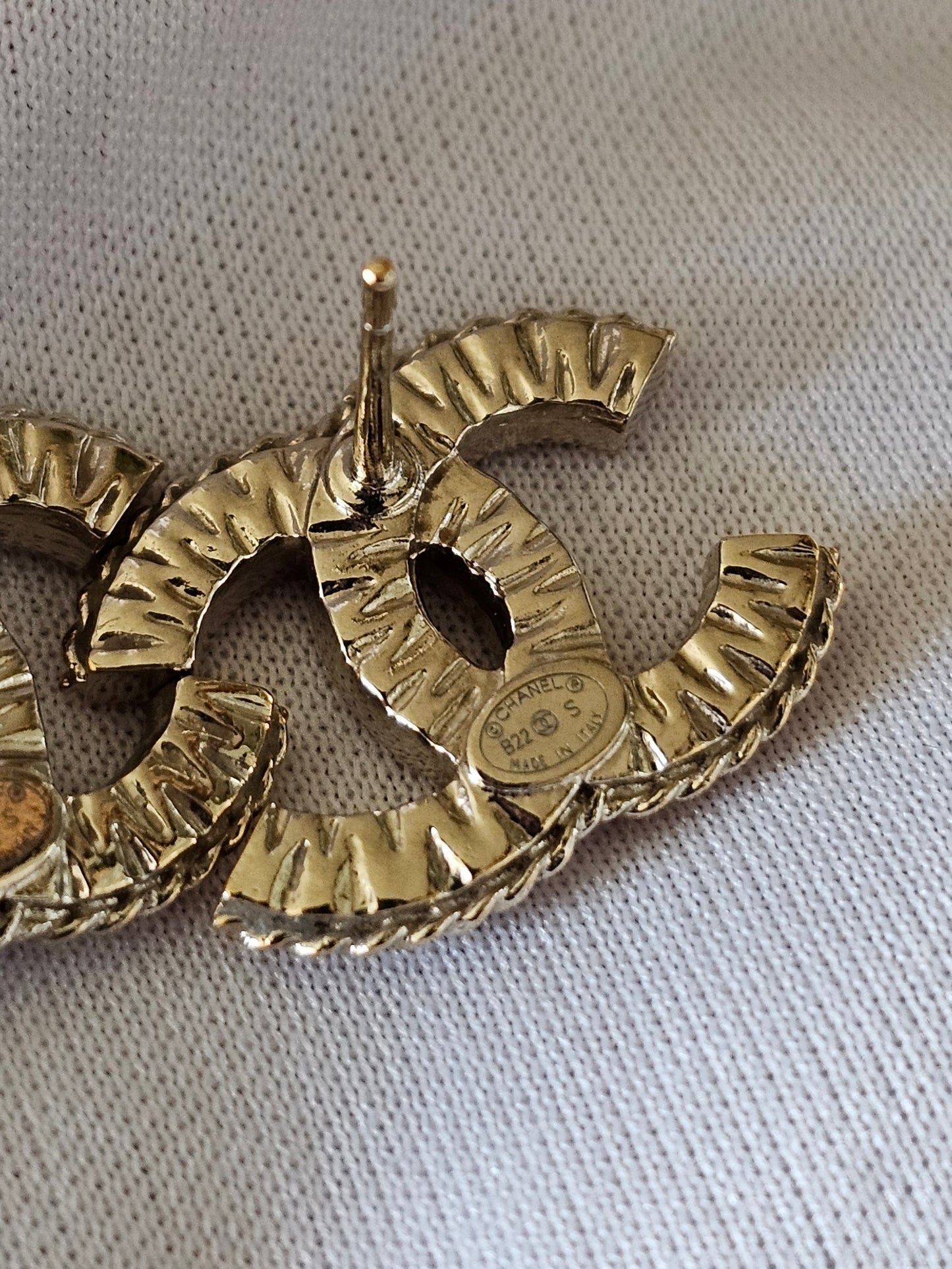 Chanel earrings, golden cc with stones.