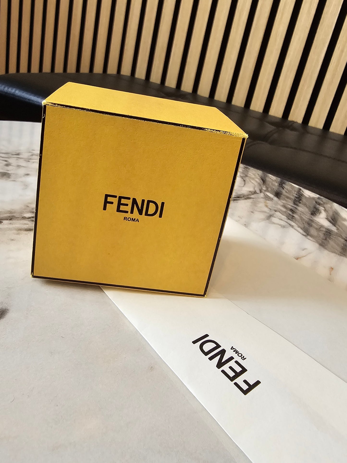 F- Fendi ring in golden with stones.