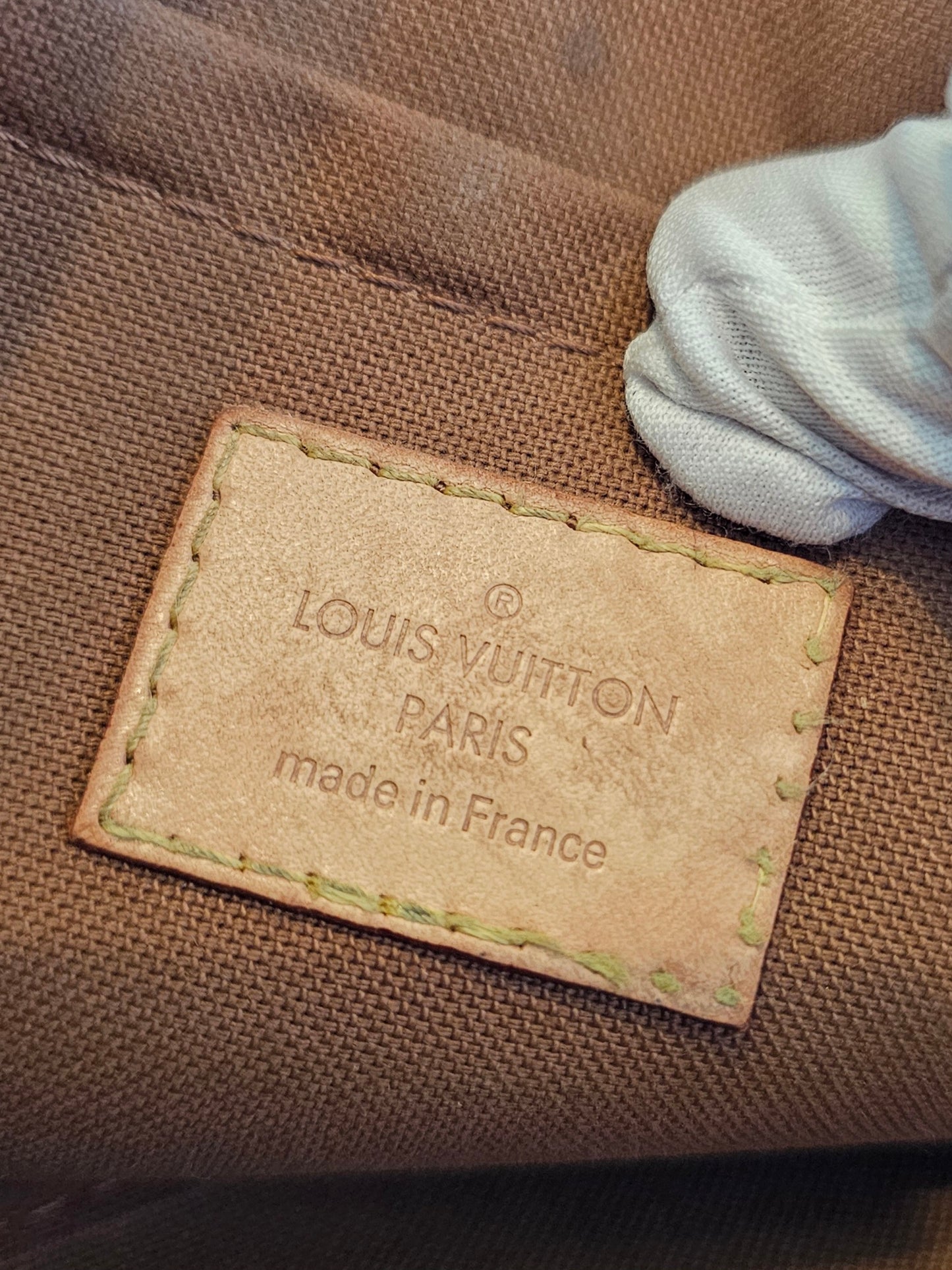 Louis Vuitton pochette accesories in monogram kanvas.