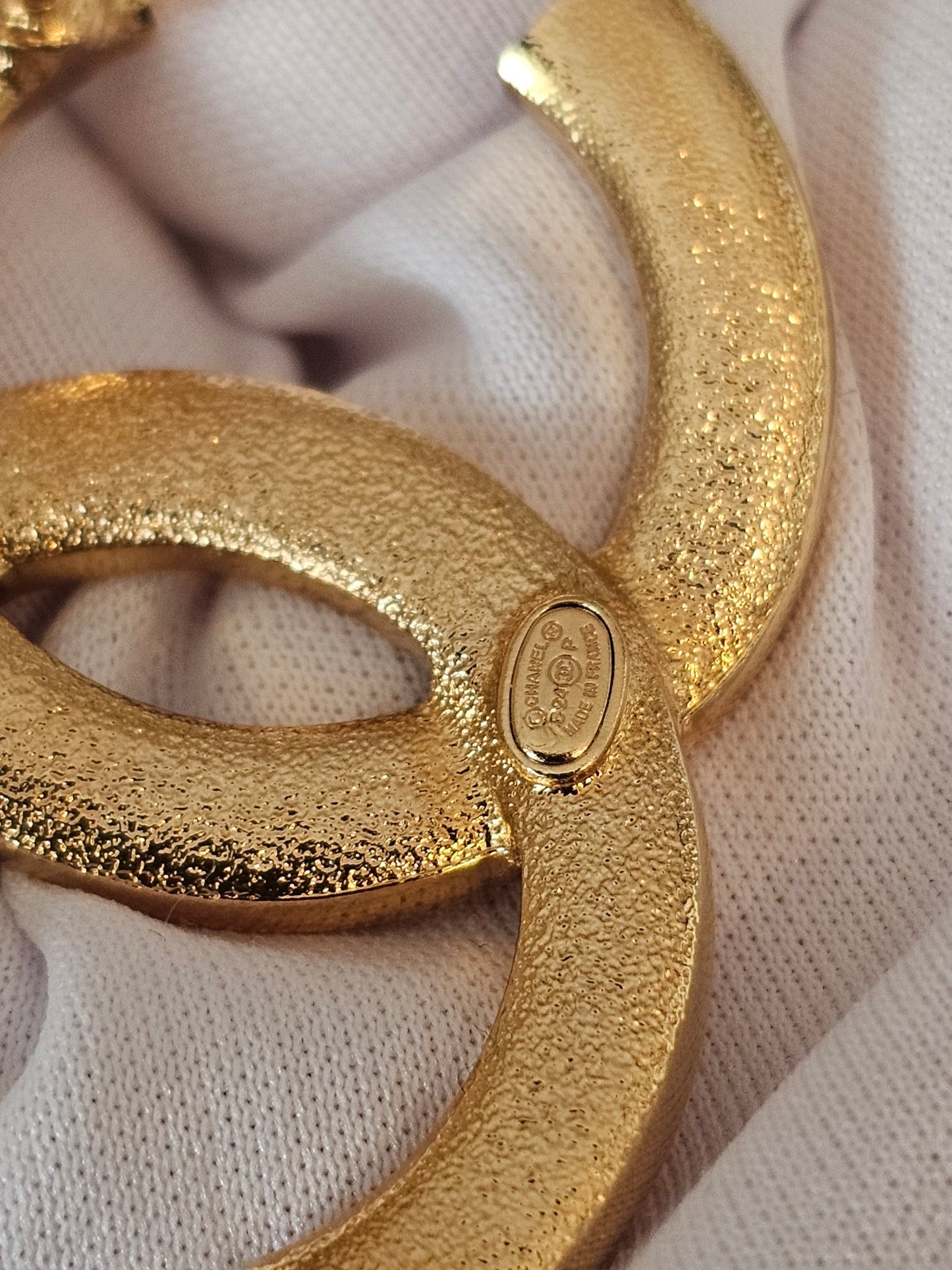 Chanel golden broche with stones and Chanel.