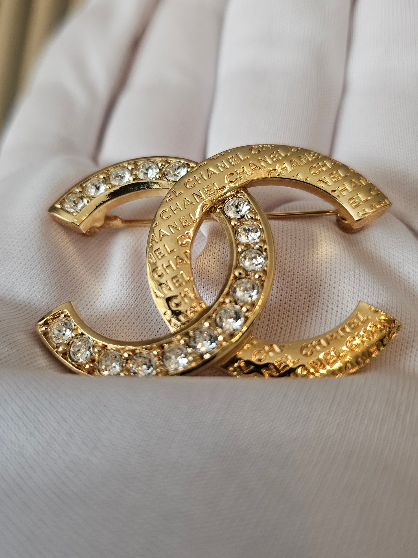 Chanel golden broche with stones and Chanel.