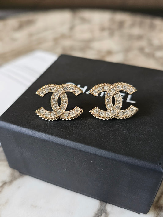 Chanel earrings, golden cc with stones.