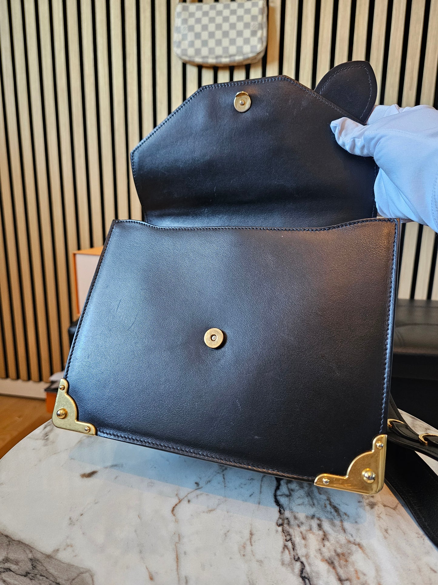 Prada Cahier bag animalier, black saffiano leather.