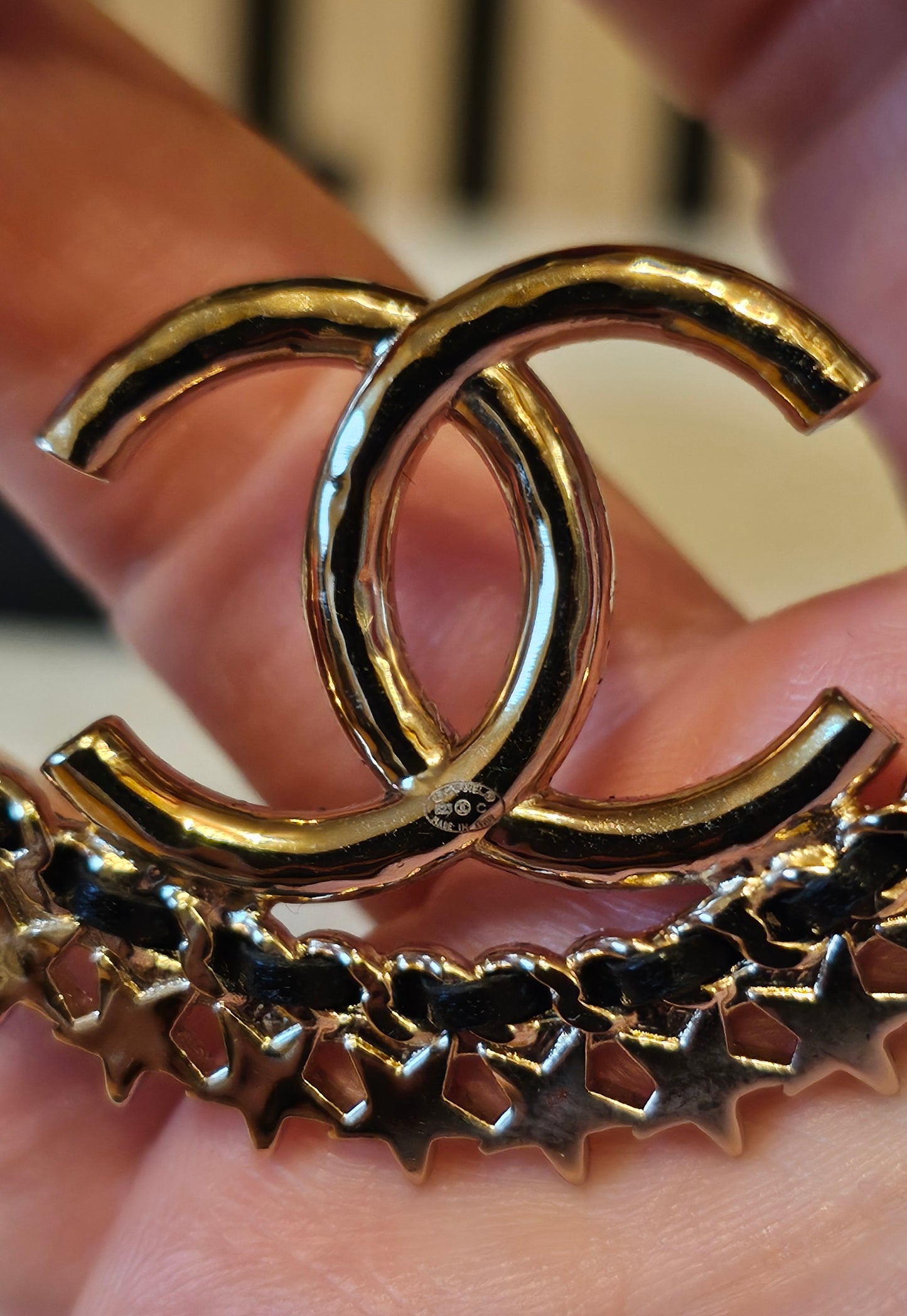 Chanel Golden hoops with crystals.