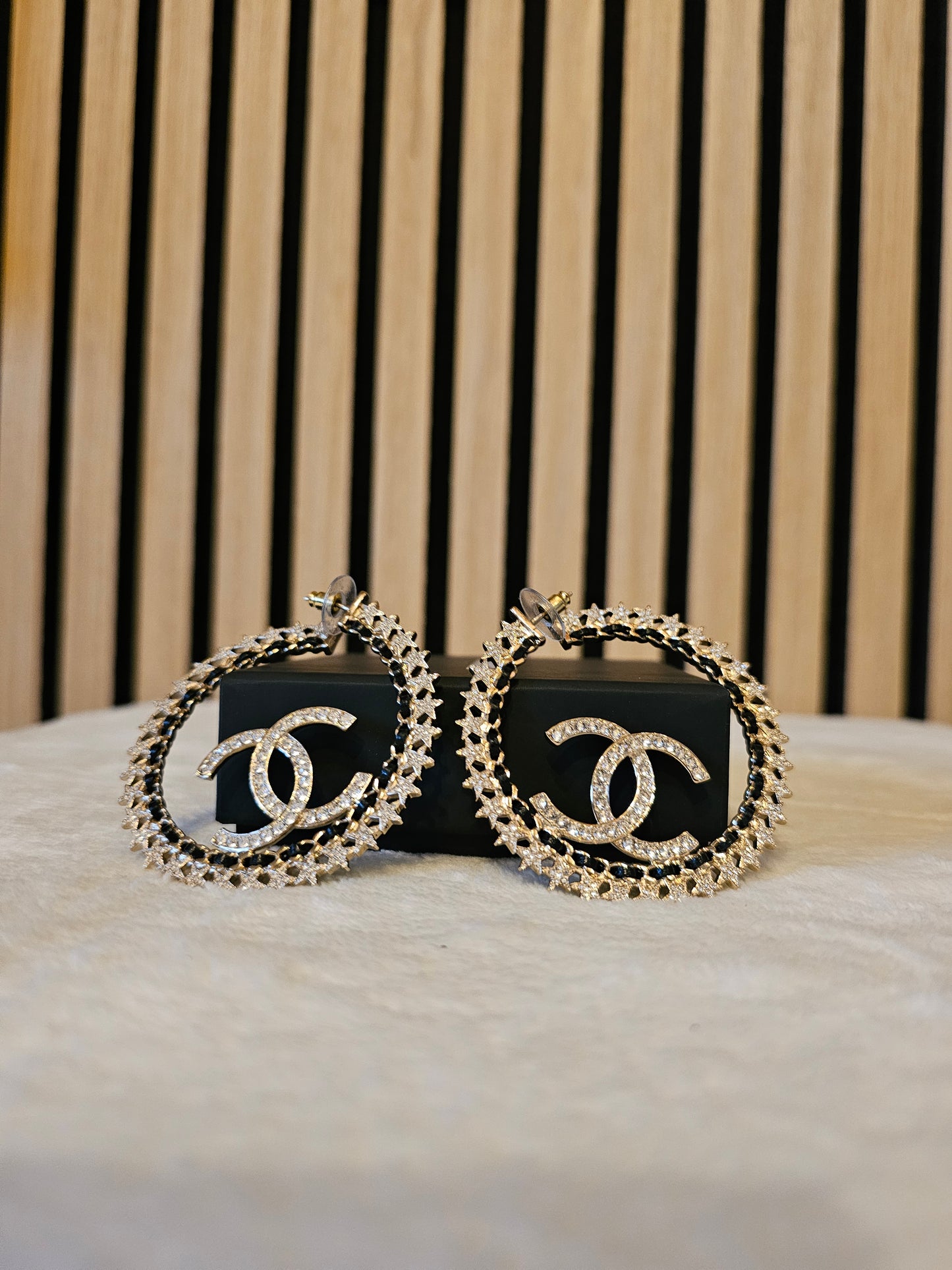 Chanel Golden hoops with crystals.