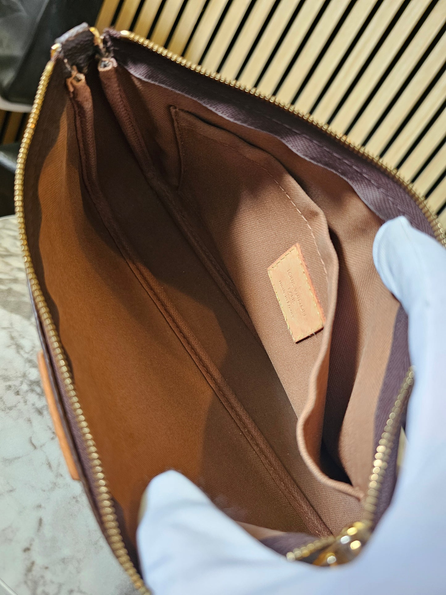 Louis Vuitton pochette accesories in monogram kanvas.