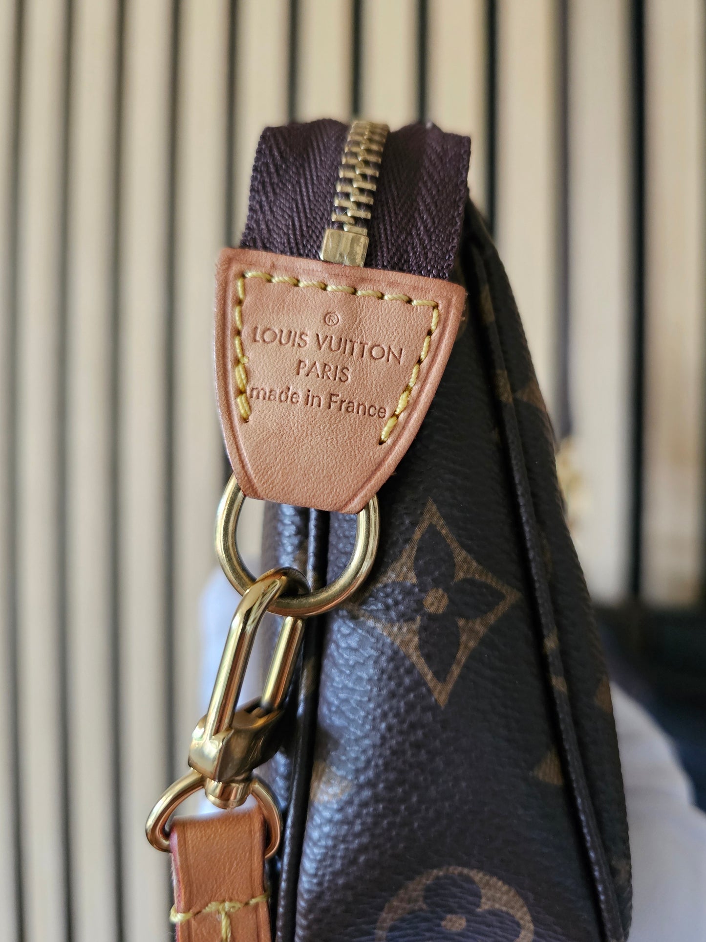 Pochette accesories NM in monogram kanvas.